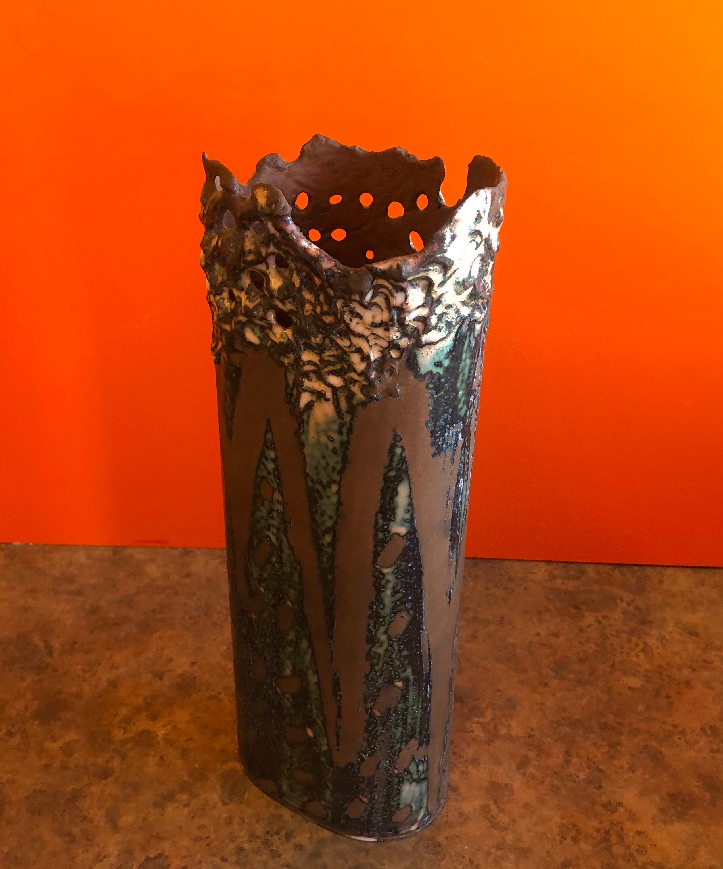 Brutalist copper vase with enamel overlay by Rita Brierton, circa 1993. The vase is very heavy and finely crafted in brown, tan and gold overlays; the piece measures: 4.5