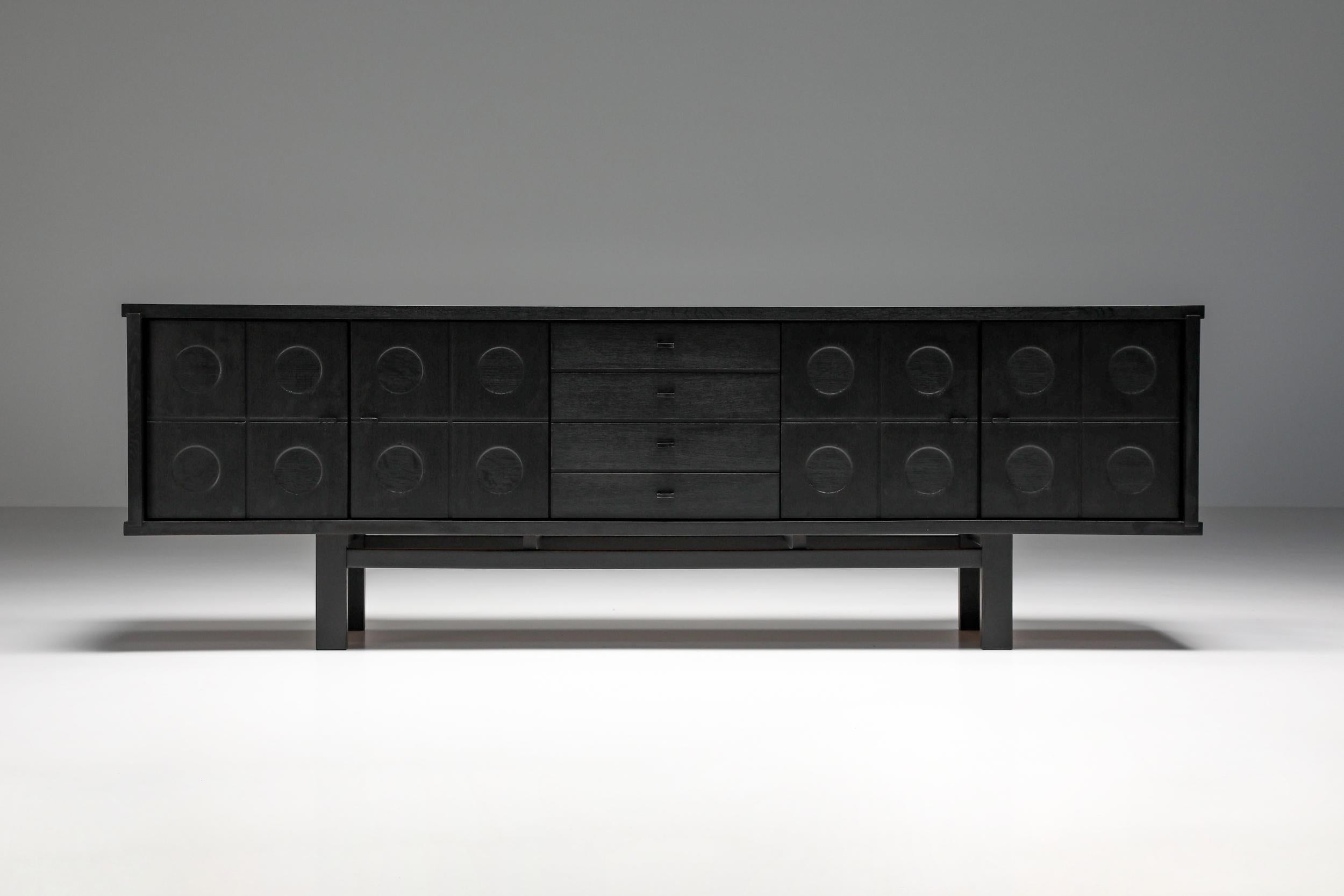 De Coene stained oak credenza, Belgium, 1970s. Floating effect; Hollywood regency; 

Brutalist De Coene stained oak credenza that fits well in an eclectic Hollywood Regency chic interior. A very rare piece, better known is its similar designs with