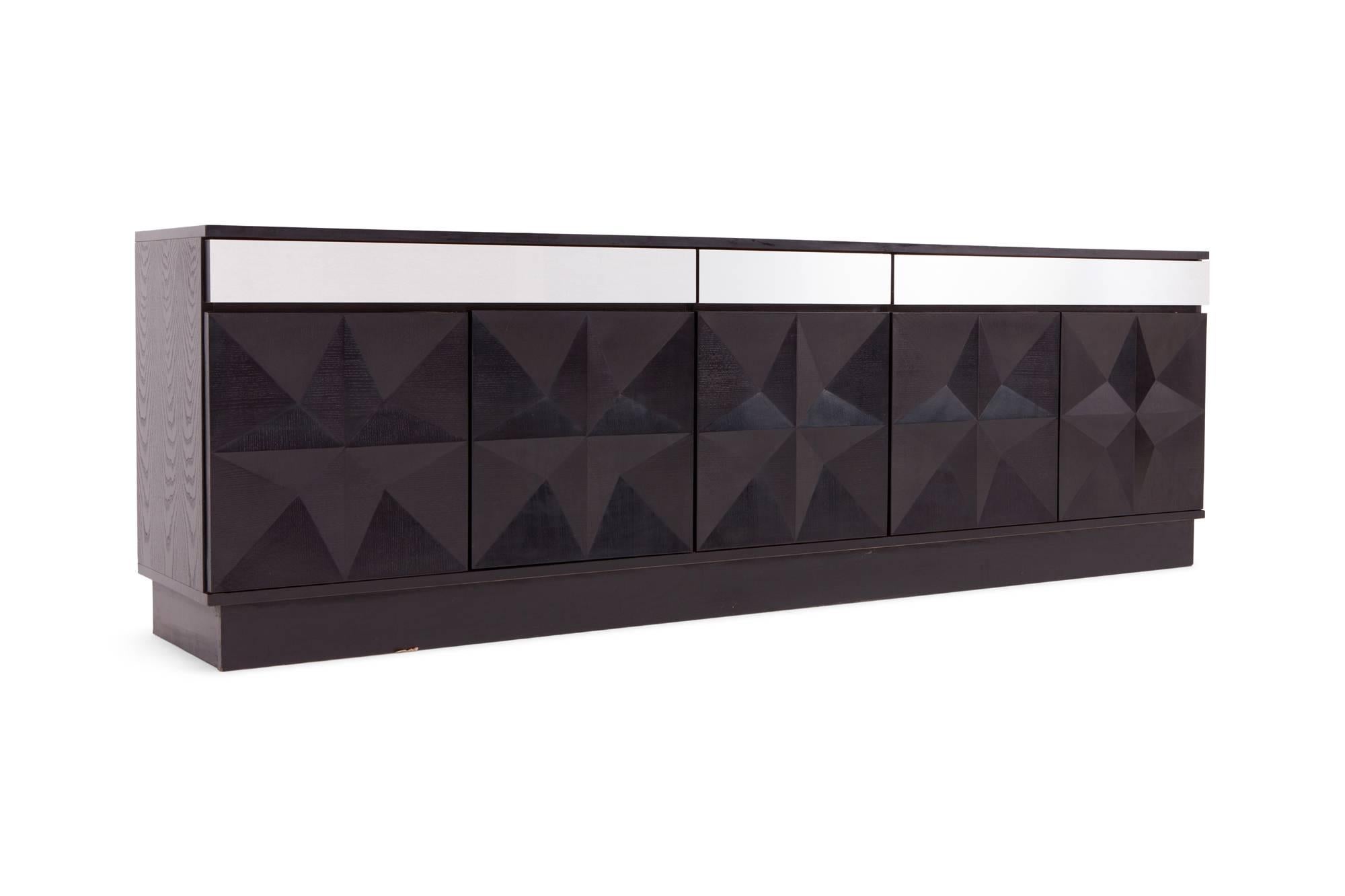 Diamond Brutalist sideboard, Belgium, 1960s

The cabinet has five decorative geometric door panels. Above the doors are three drawers; two larger and one small one. The drawers are finished with brushed steel , giving this piece a modern