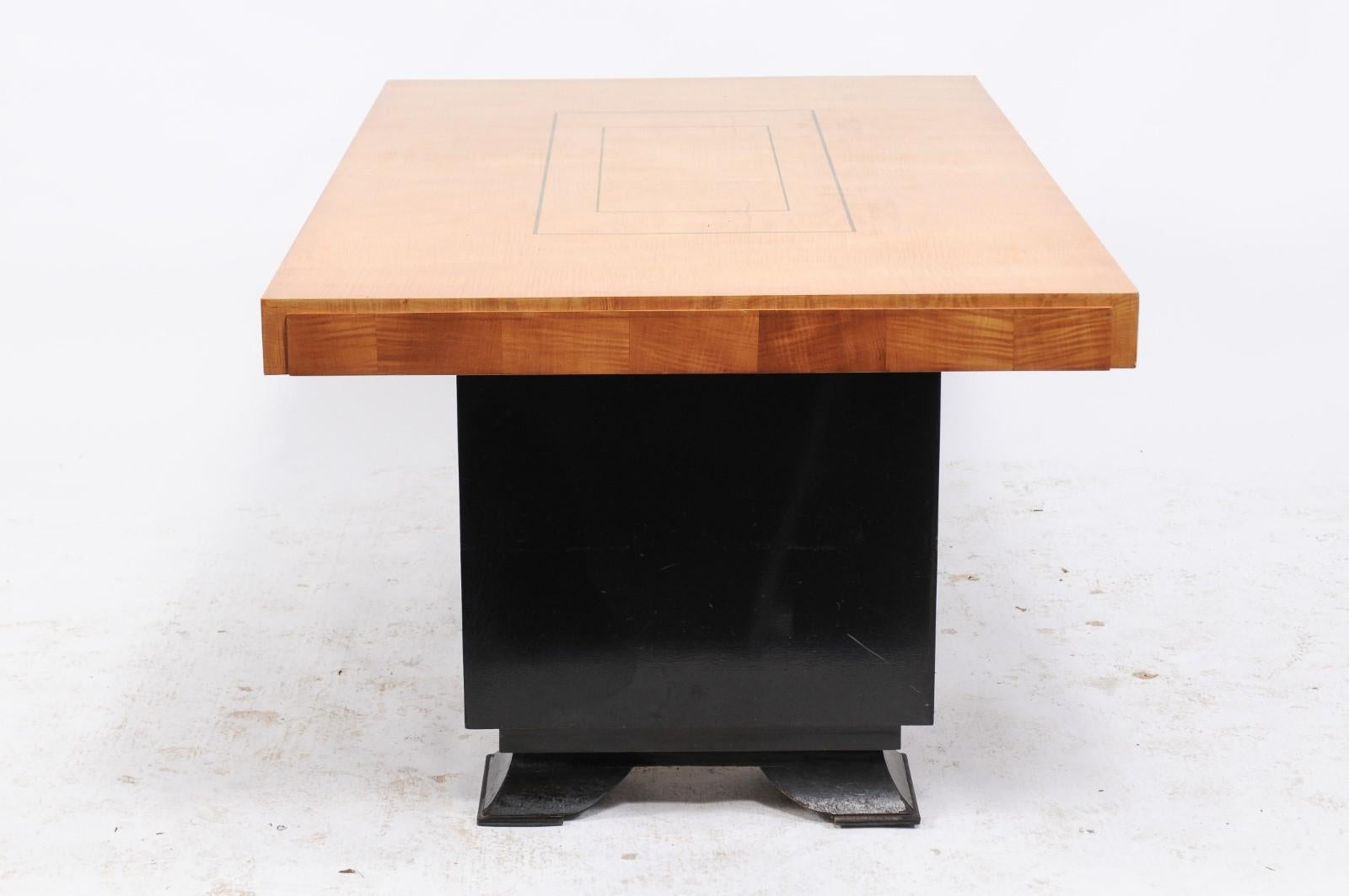 A Belgian Brutalist period table from the mid-20th century, with rectangular top, Pagoda style black base and green accents, in the style of the De Coene Freres. This unique, one-of-a-kind handmade table is an original design from Belgium of
