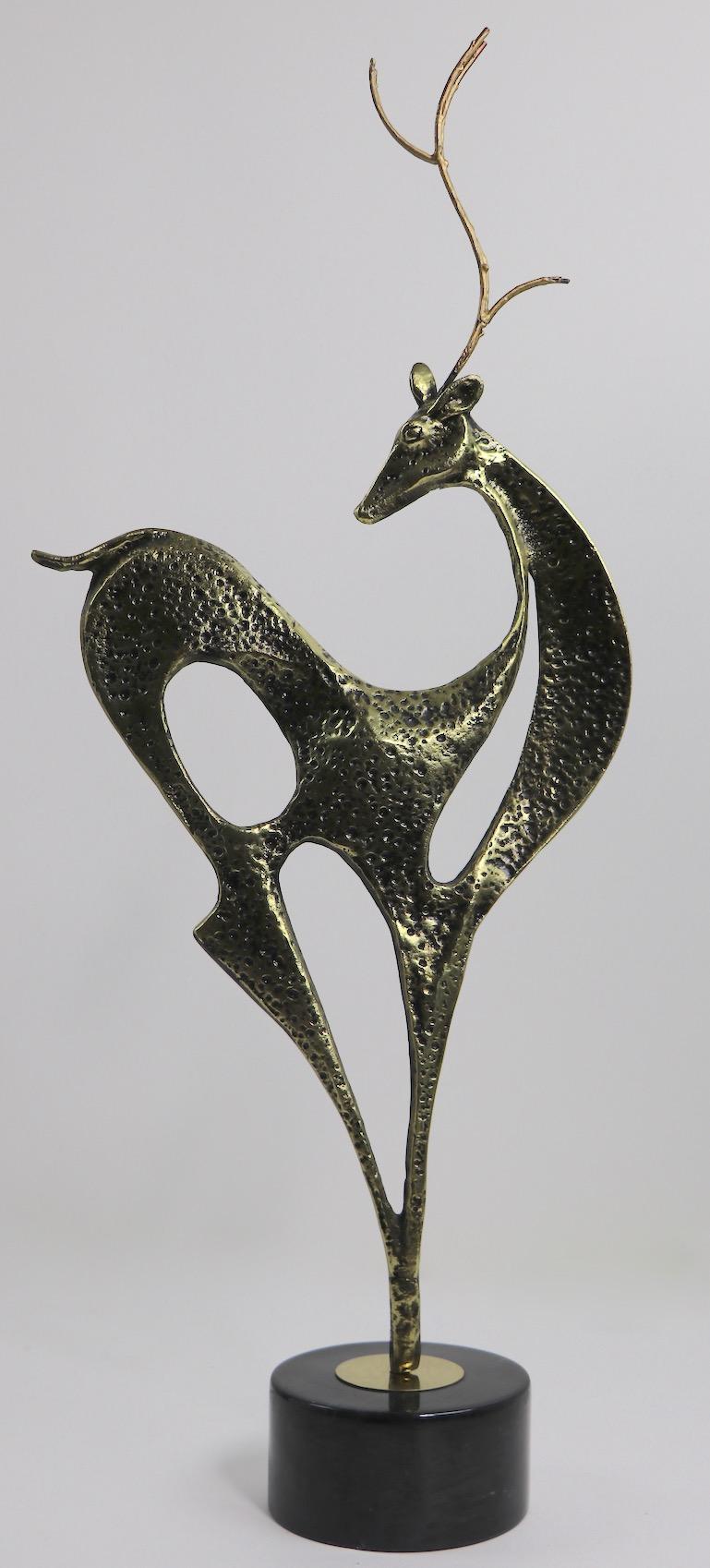 Brutalist School sculpture of stylized deer, circa 1980s, by Jere. Solid cast brass on black marble plinth base. Measures: Base 6 inch diameter x 3 inch height. Very good, original condition, unsigned.