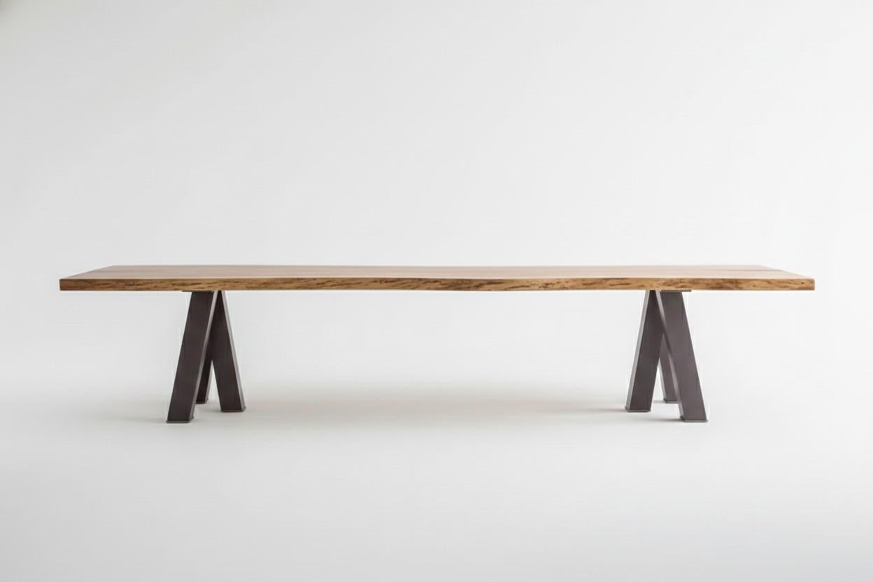 This dining table is made from solid rough oak over steel legs.
The top (approx 4cm) has blackened sapwood edges, made from the sides of the oak tree. Made to measure table, where almost any size is possible.
This item is made of solid wood.  Any