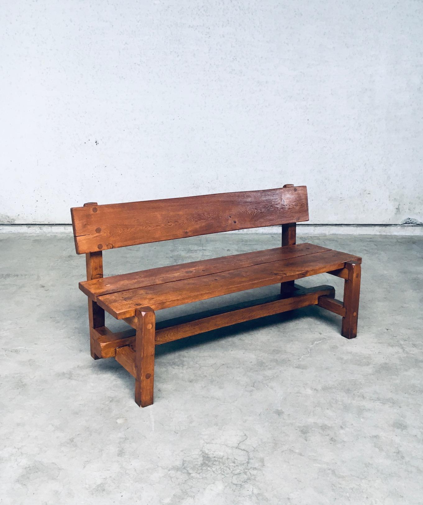 Vintage Midcentury period Brutalist Design Hand Crafted solid oak heavy Bench. Made in Belgium, 1960's / 70's period. Solid oak constrcuted heavy bench with thick beams and solid slabs of oak wood for seat and backrest. Nice constructivist in