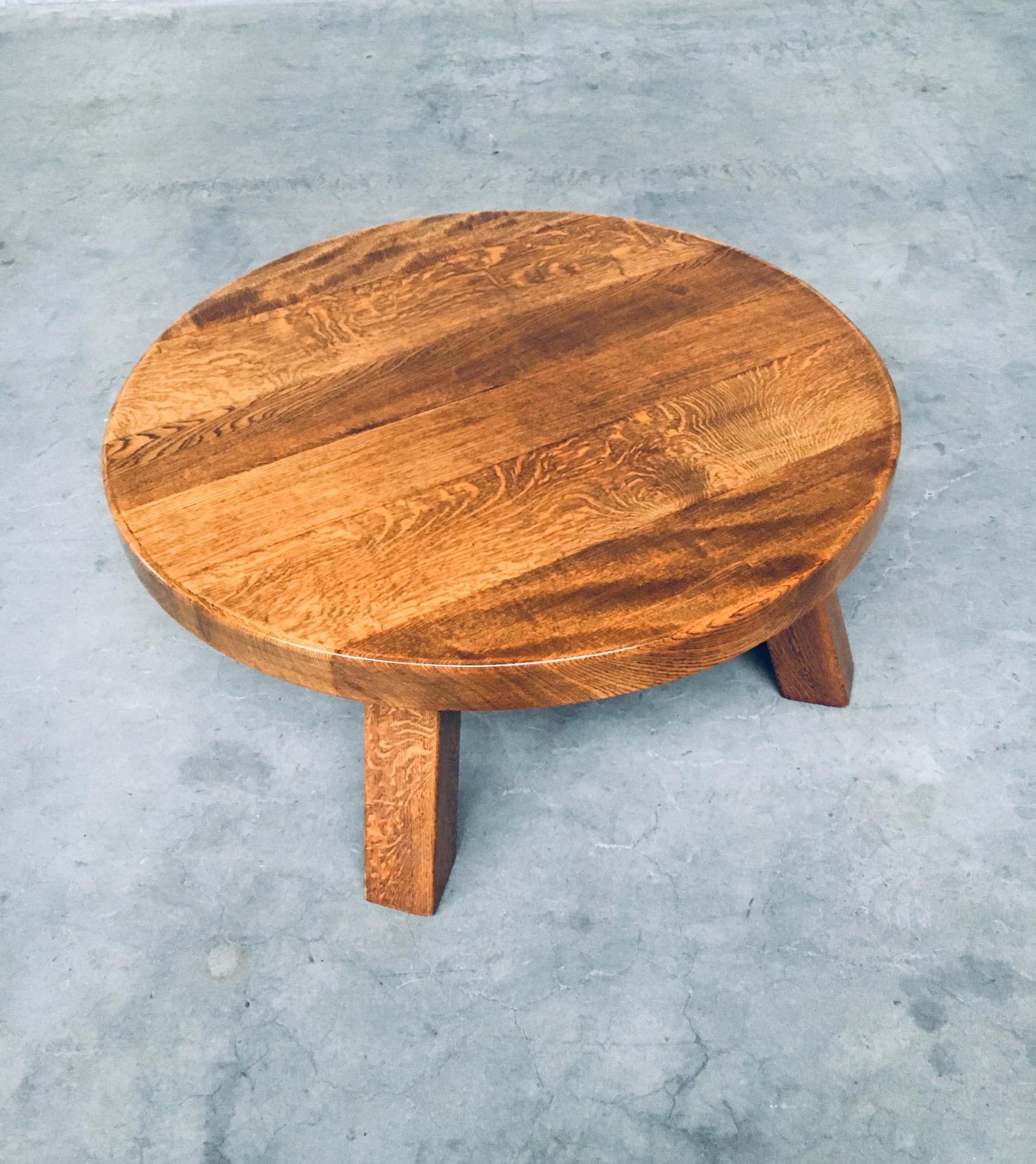 Vintage mid century Rustic Brutalist style design massive oak round coffee table. Made in the 1960's, in Belgium. Solid oak wooden construction. All original and very good condition. Measures 98cm x 44cm x 98cm.