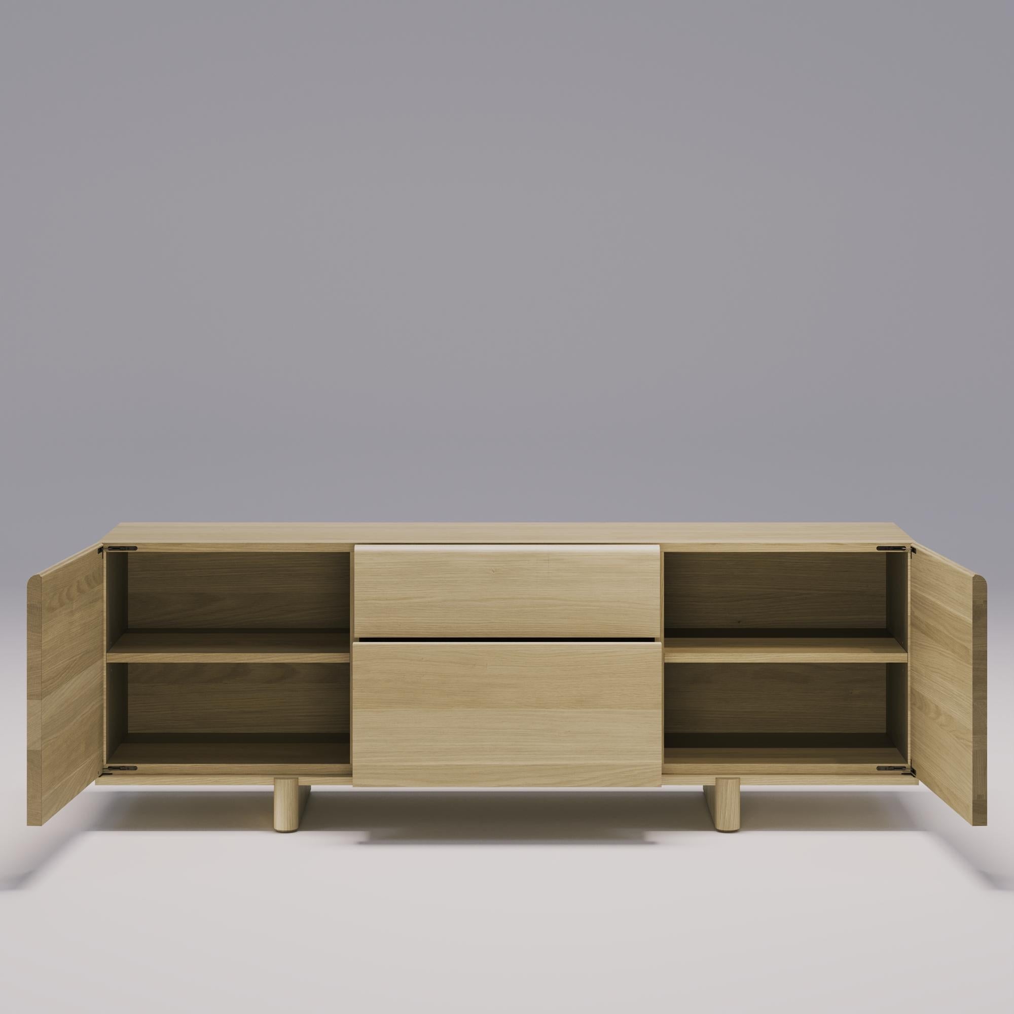 This unique sideboard has bold geometric shapes and a simple, clean look. Made with high-quality walnut or oak wood, it's not only durable but also brings out the natural textures. The rounded edges and precise proportions add to its appeal.
With