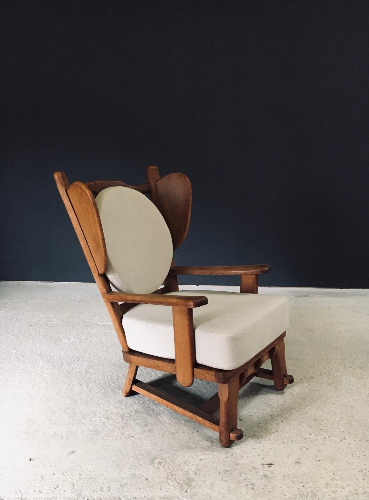 Vintage Brutalist Design Oak Wingback Lounge Chair. Made in the Netherlands, 1950's / 60's period. Solid oak constructed fauteuil. New seat and back cushions have been made to measure this wonderful arm chair. This comes in very good condition.