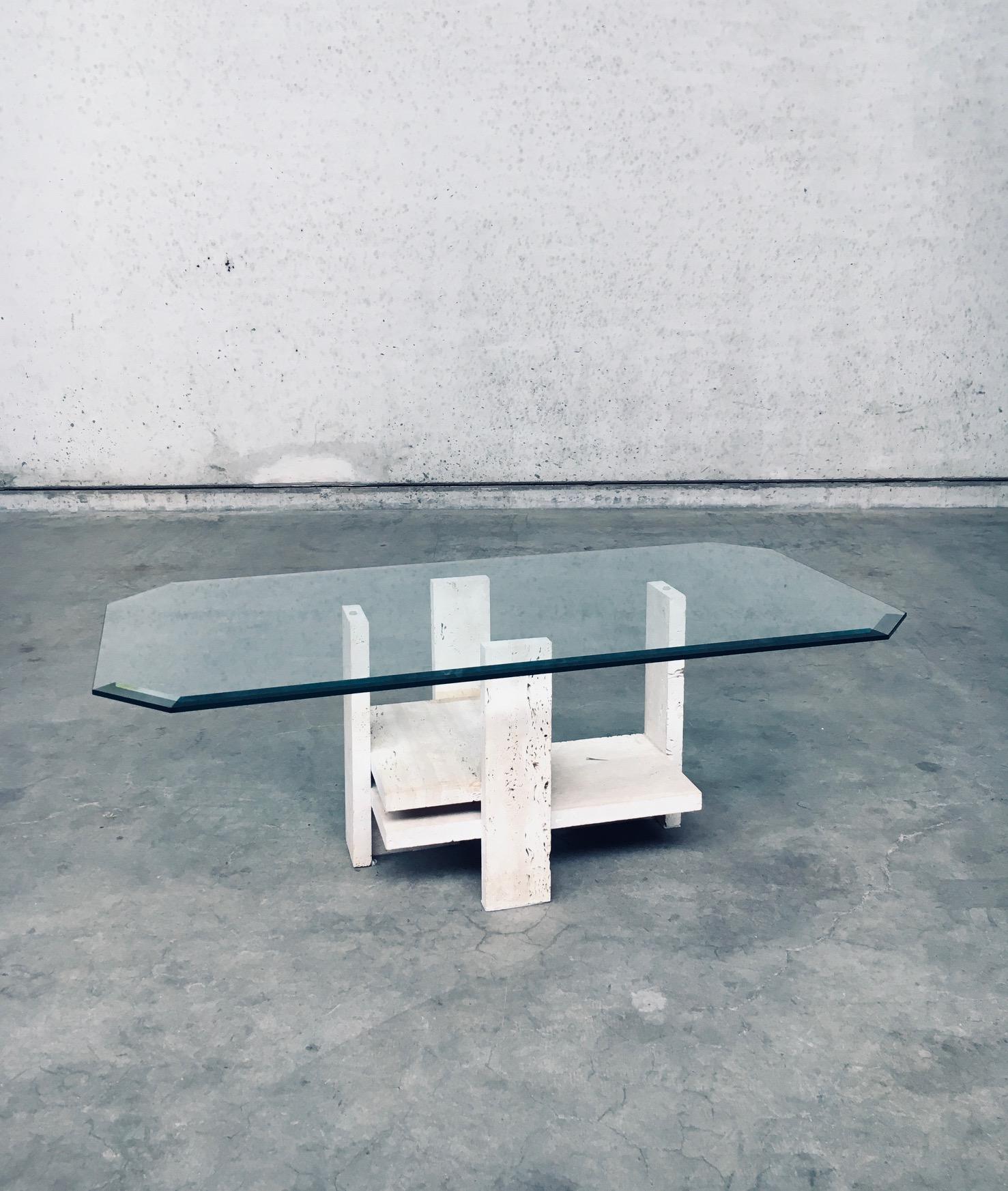 Vintage Architectural Brutalist Design Coffee Table by Willy Ballez. Made in Belgium in the 1970's period. Travertine Marble Architectural Base with octagonal glass top. This comes in very good, all original condition. Measures 42cm x 120cm x 60cm.