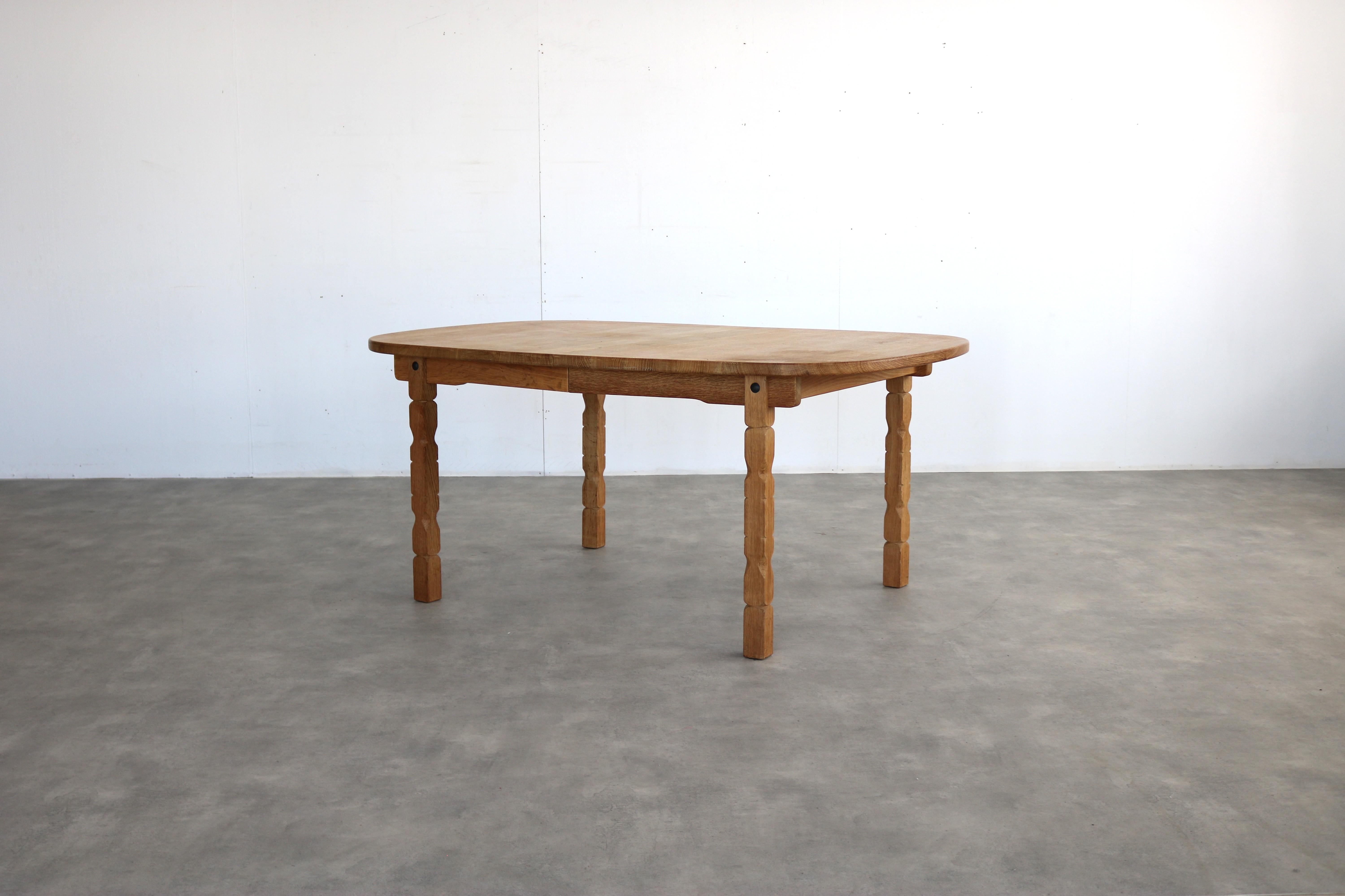 brutalist dining table  vintage table  oak  

period  1960s
design  style Henning Kjaernulf    Denmark
condition  good  minor signs of use
size  72 x 159 x 114105 (hxbxd) + 2 extra leaves of 50 cm each; 

details  oak; extendable; 

article number 