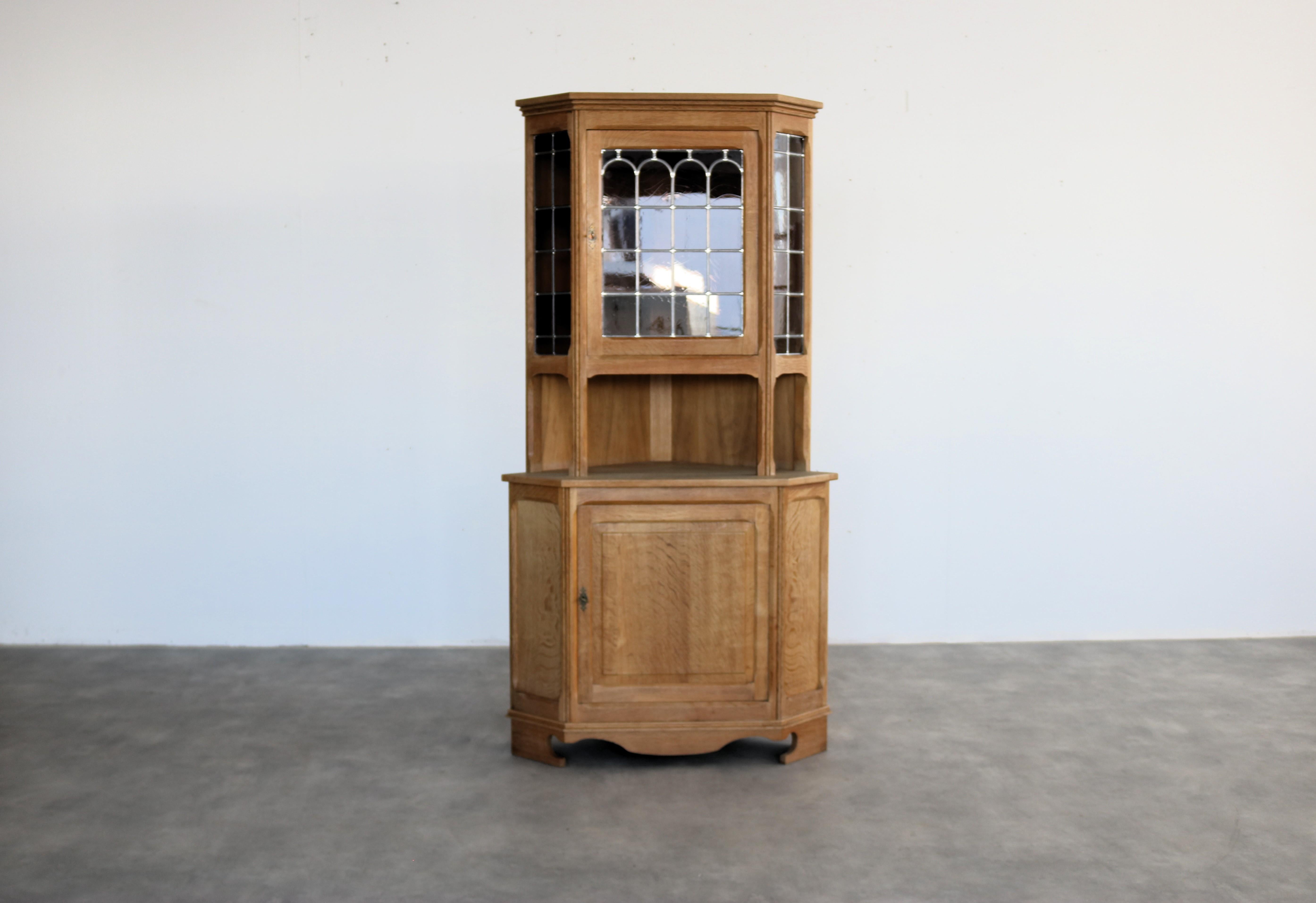 Brutalist display cabinet  corner cabinet  1960s  Danish

period  1960s
design  N.O. Andersen  Scan Rustic  Denmark
condition  good  minor signs of wear
size  180 x 93 x 63 cm (H x W x D) depth is the corner section;

details  oak; glass;

item