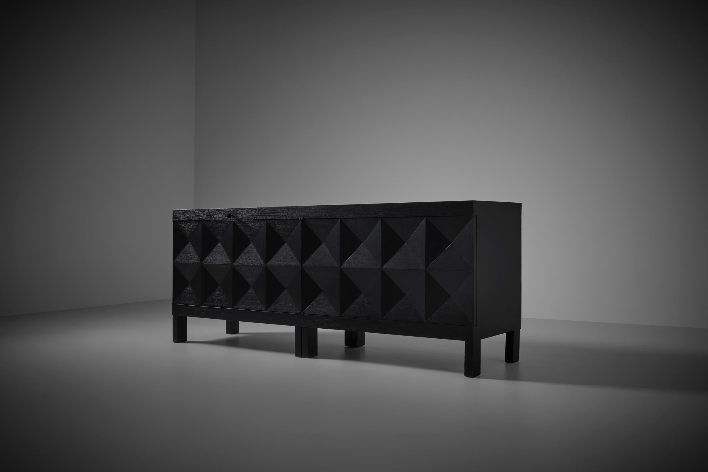 Stunning Brutalist sideboard by J. Batenburg For MI, Belgium ca. 1969. High quality production and one of the nicest models in this graphic brutalist genre. Made out of black stained Oak with a beautiful outspoken grain. The repeating op-art design