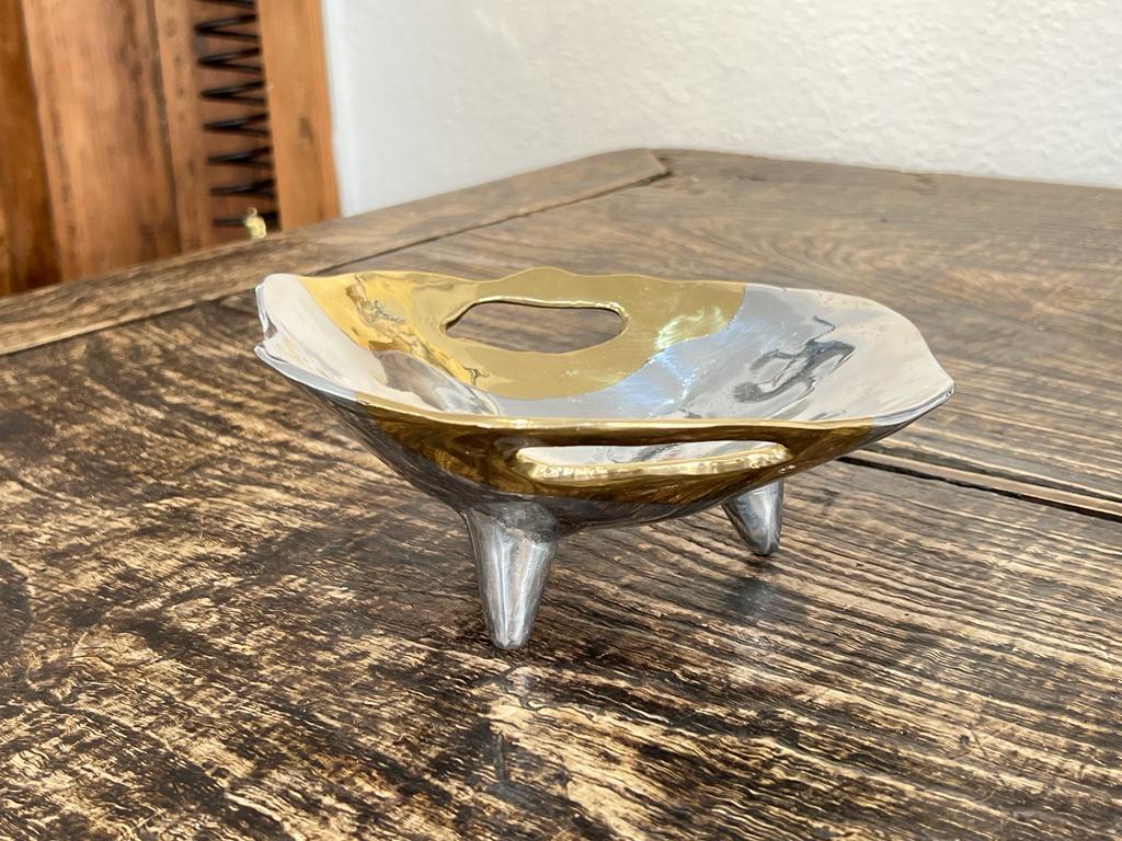 The decorative Sweet Bowl was created by David Marshall, it is made of sand cast aluminum and sand cast brass.
Handmade, mounted and finished in our foundry and workshop in Spain from recycled materials.
Certified authentic by the Artist David