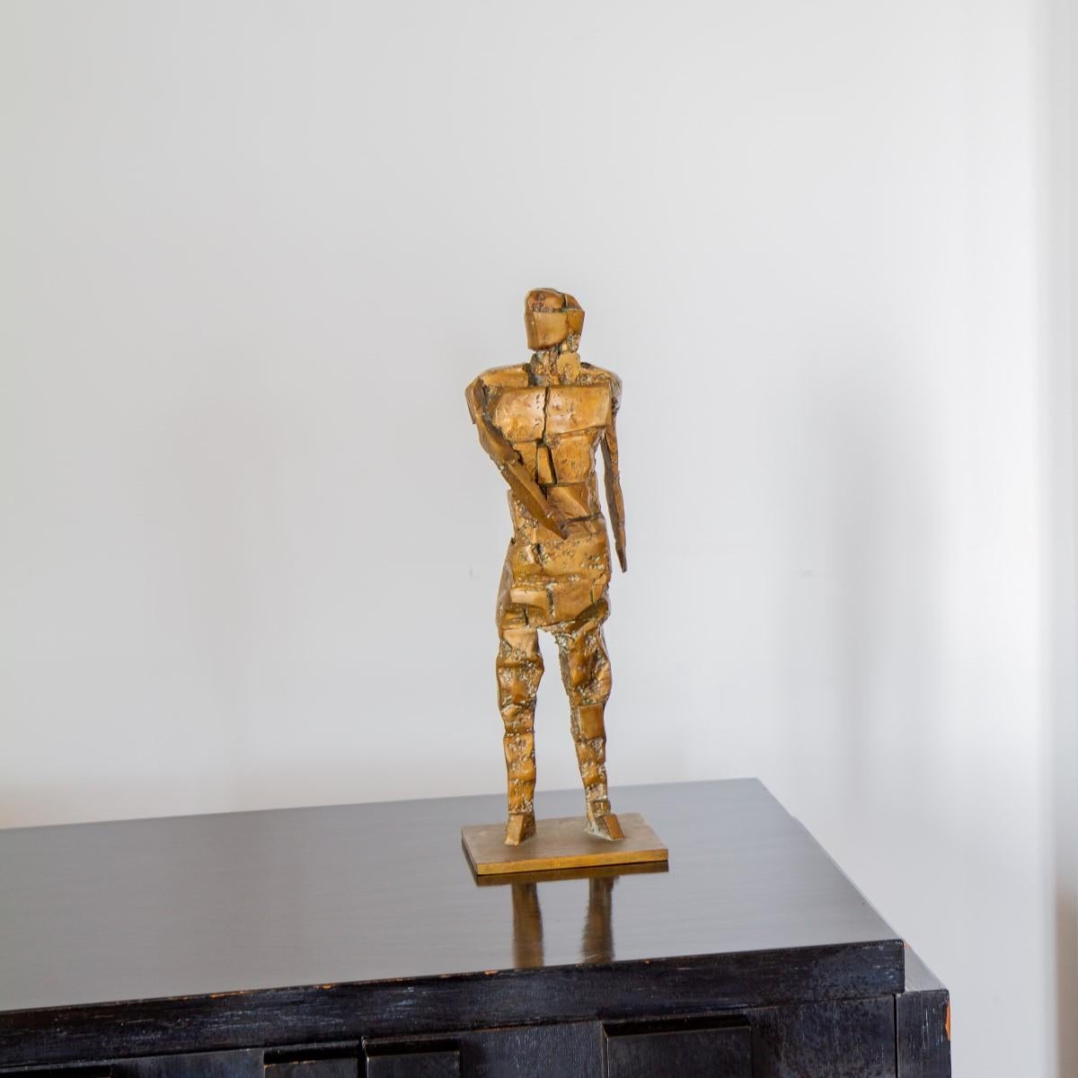 A Brutalist figurative bronze table sculpture, signed JR.