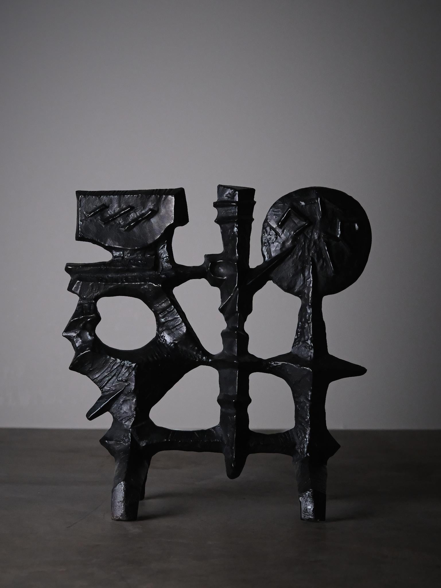 Rare fire screen designed by Olle Hermansson for the Swedish company Husqvarna in the middle of the 20th century. 

Abstract design made in cast iron. Makers mark on back. 