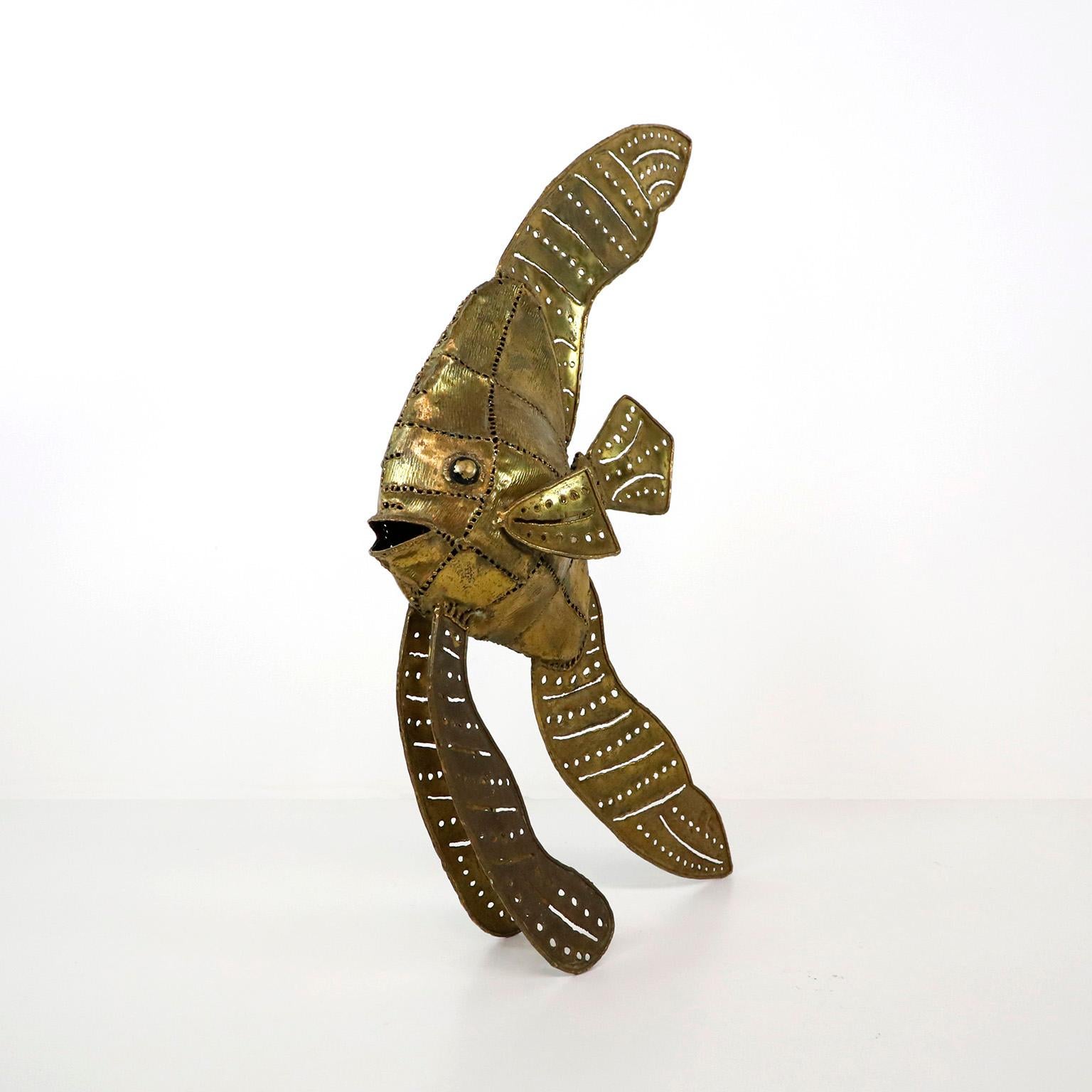 Circa 1970. We offer this Brutalist Fish sculpture made in Brass.