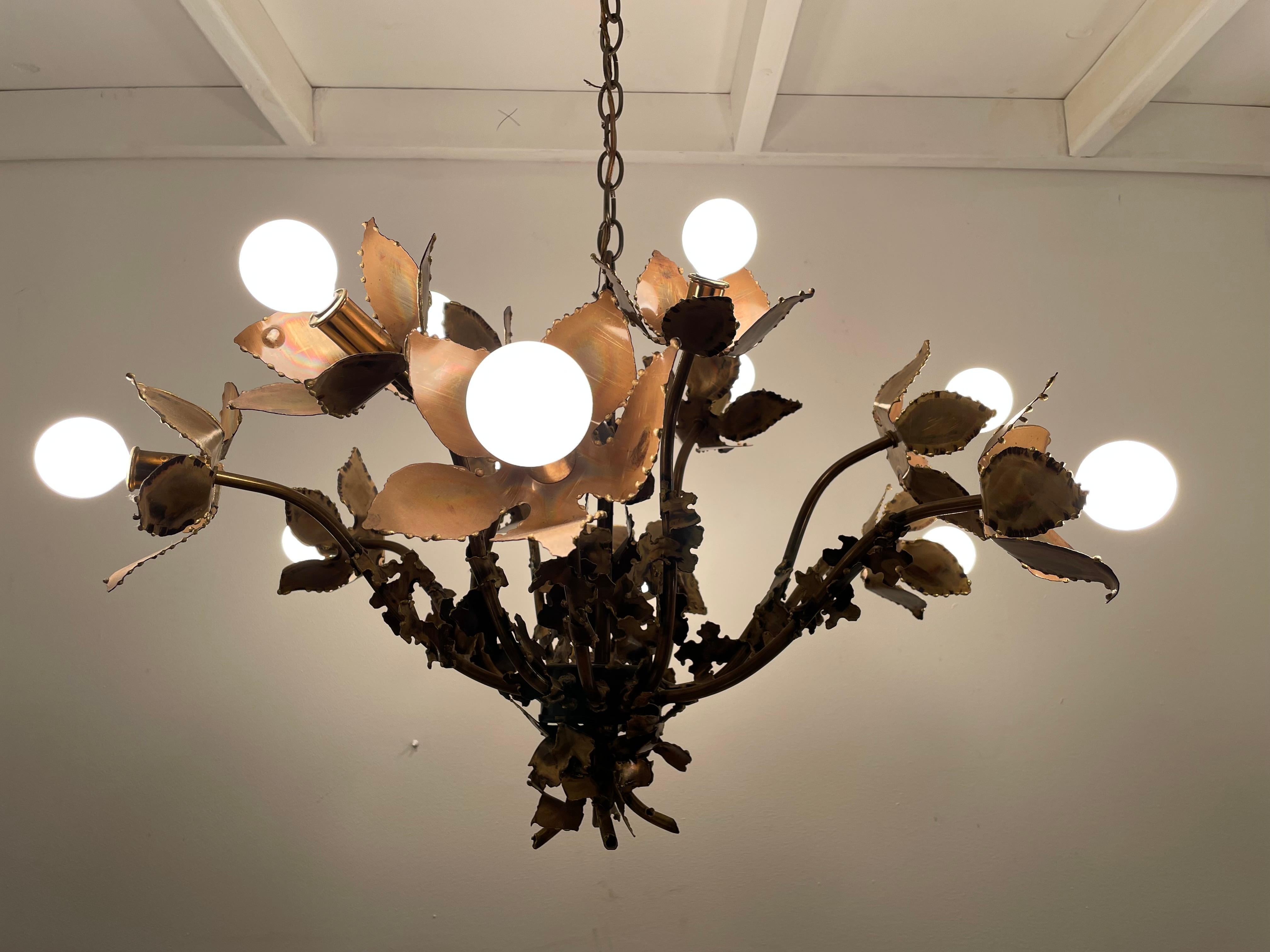 Beautiful Brutalist floral theme chandelier by Feldman with bulbs in center of each flower.