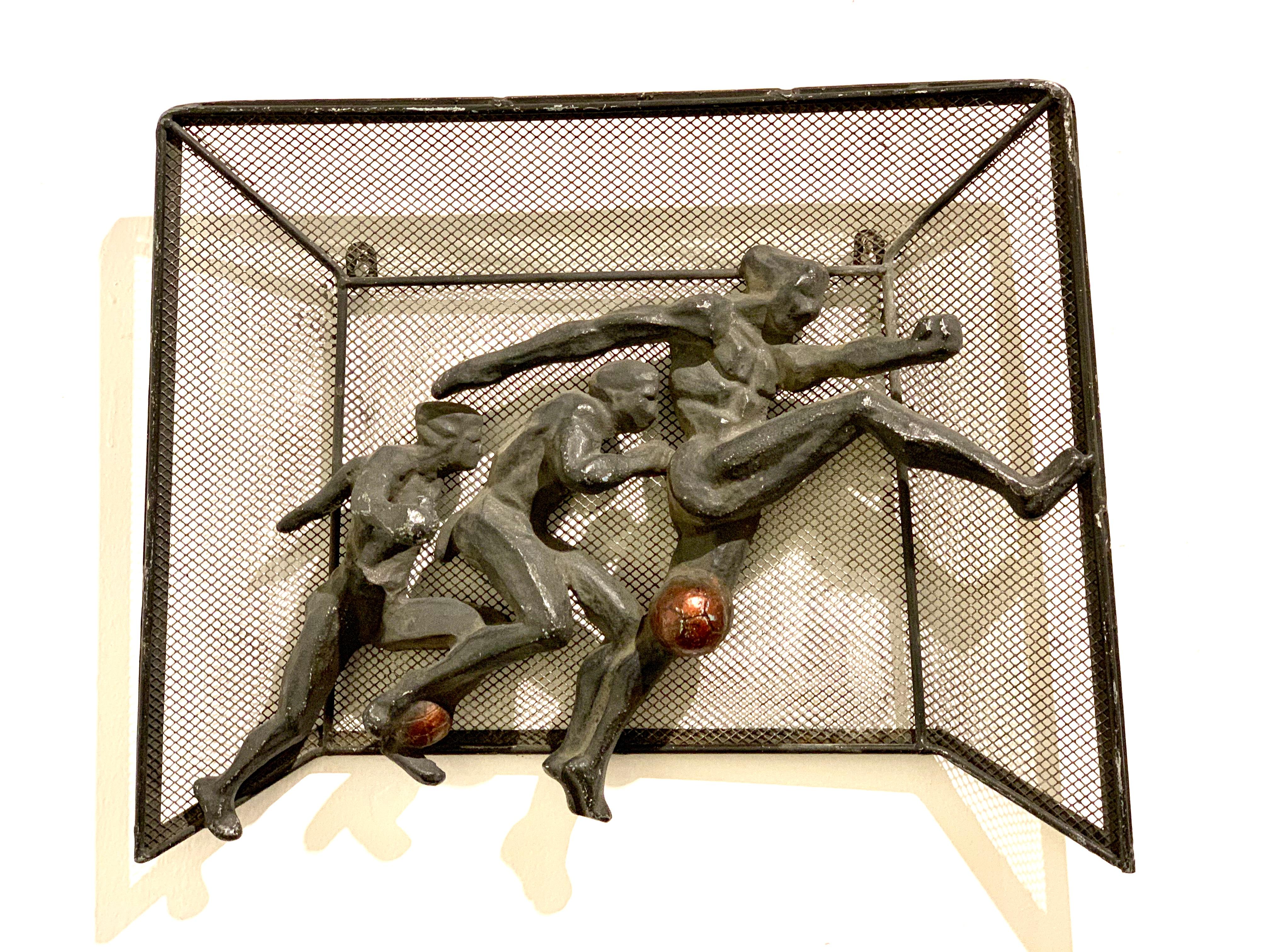 Brutalist football players metal wall art. Metal is dark, yet appears gray as there is no clear coat on the art work.
