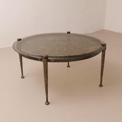brutalist forged round coffee table with cast glass in style of Lothar Klute