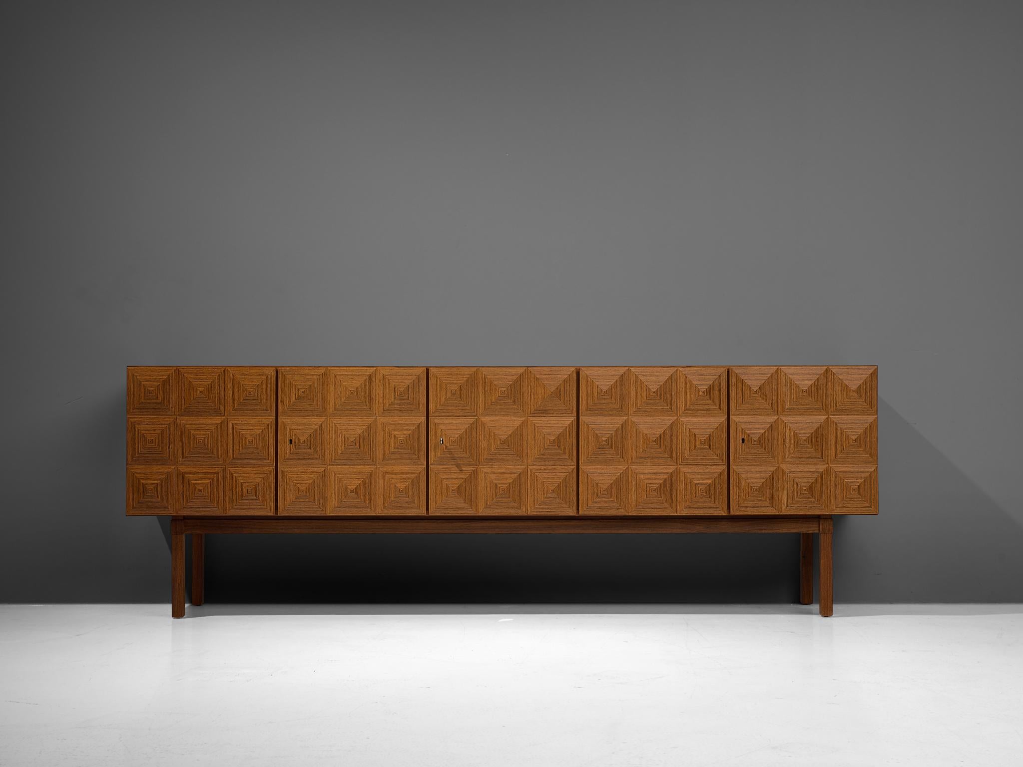 Franz Meyer, sideboard, rosewood, Germany, 1960s

Subtle ‘brutal looking’ sideboard by master furniture maker Franz Meyer from the 1960s. The doors of this cabinet feature a diamond-shaped structure, which highlights the rosewood in an
