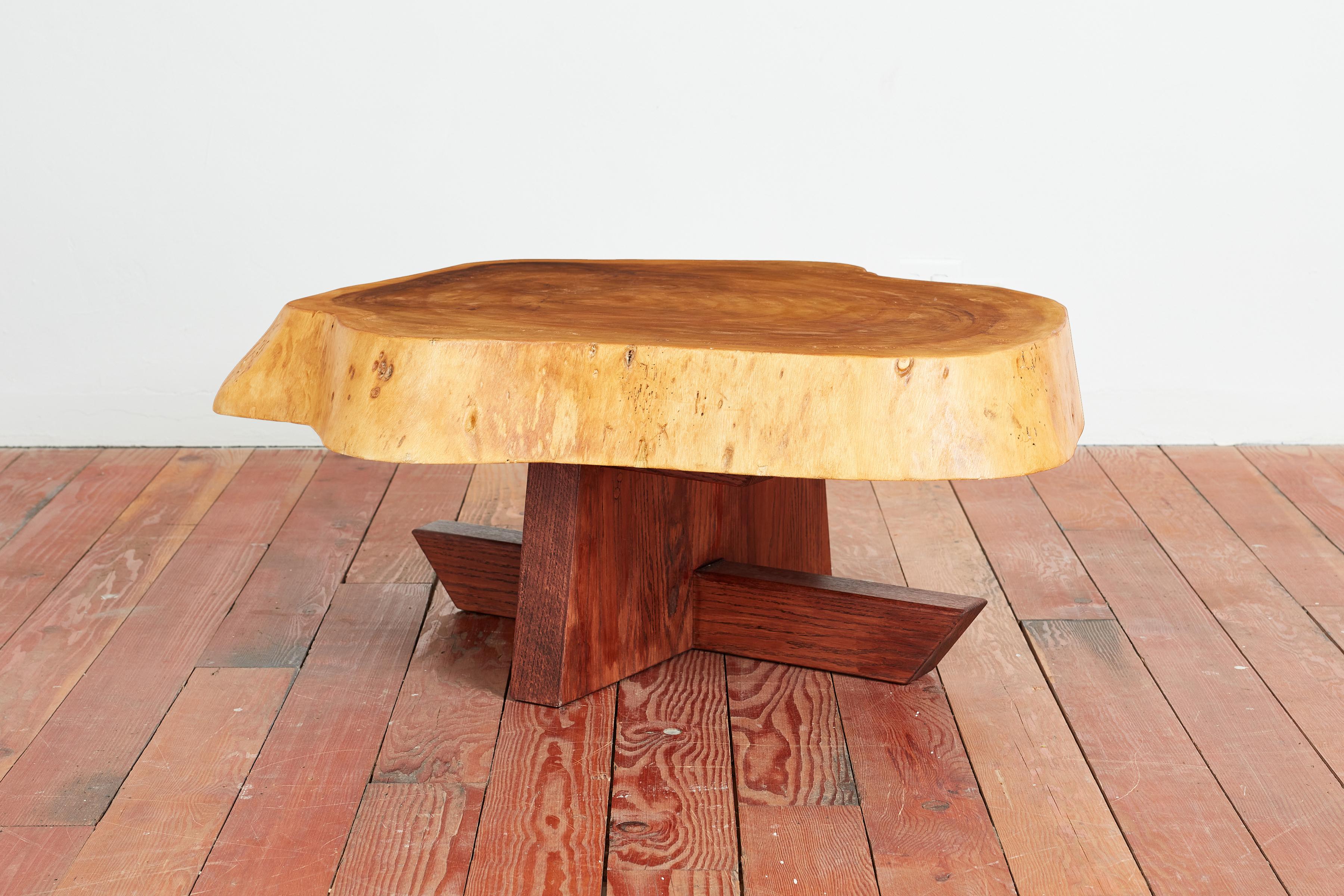 Gorgeous brutalist vintage coffee table constructed of exotic wood 
Beautiful patina and imperfections of the tree
Solid free form shape with organic live edges and angular base. 
France - 1950s 