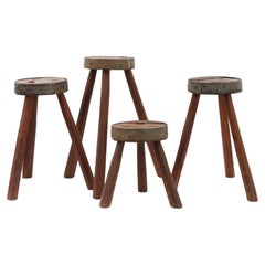 Brutalist French 1850s solid oak tripod stools with metal rim, set of 4