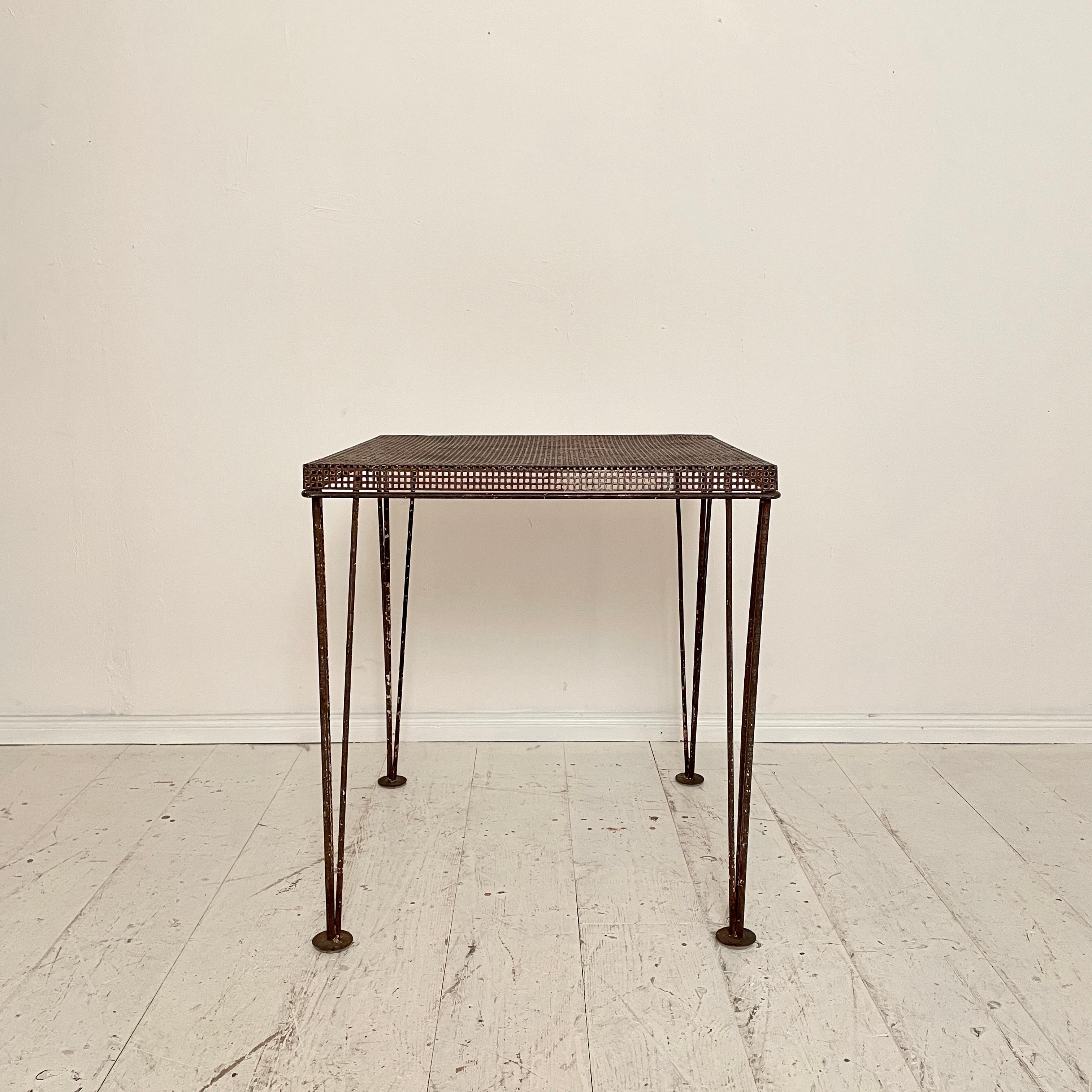 This great Brutalist French iron side table, was made around 1960. The frame is made of iron and the table top is made of iron perforated plate.
A unique piece which is a great eye-catcher for your antique, modern, Space Age or mid-century