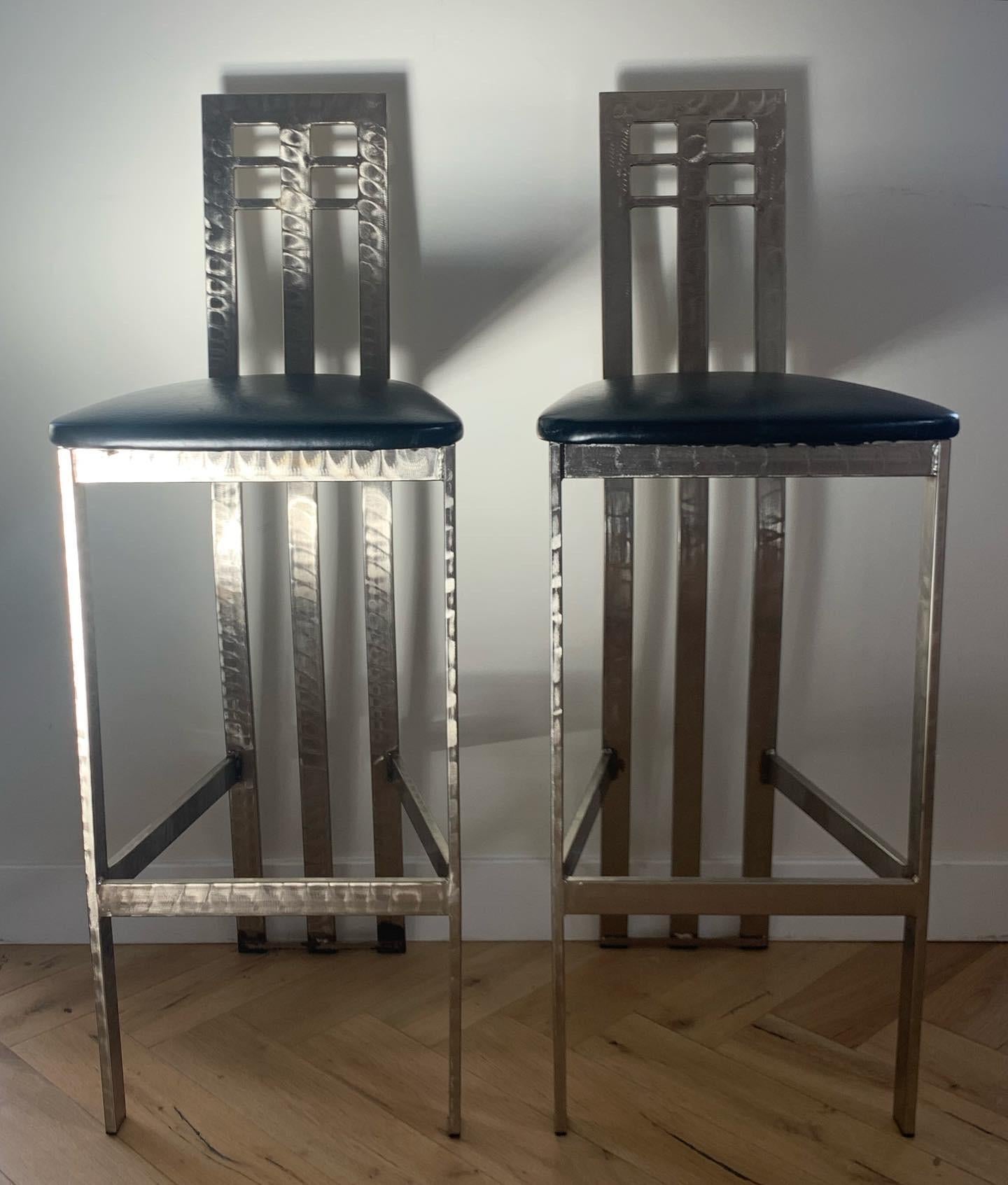 Pair of Brutalist /Futurist style vintage bar stools in treated chrome and black leather circa early 1990s. Some scruff to the metal (slide 5) and minor wear to leather (slide 6), but overall fab condition. Please don’t hesitate to reach out for a