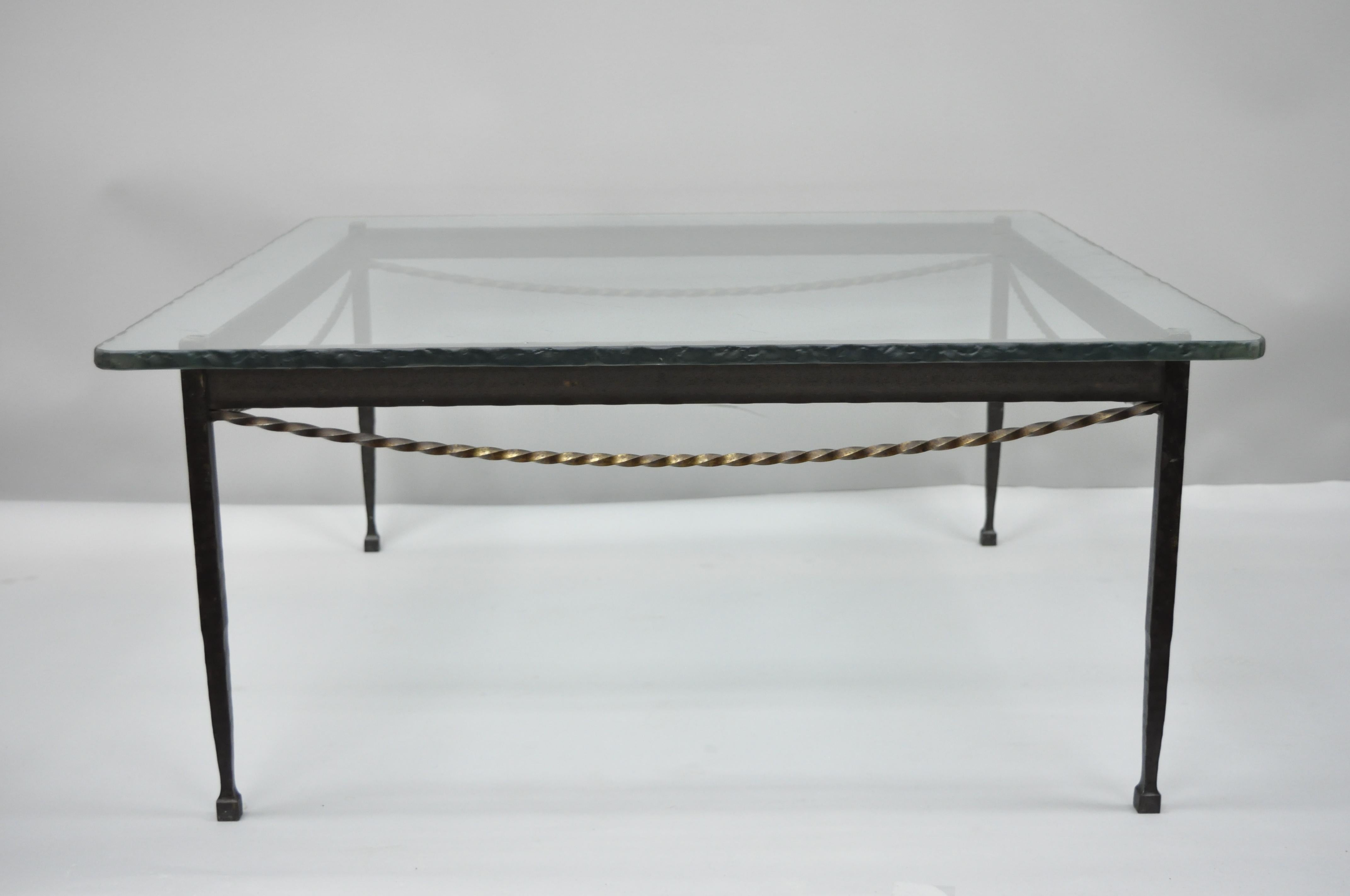 Brutalist Giacometti style forged iron and rippled glass square coffee table. Item features 0.5