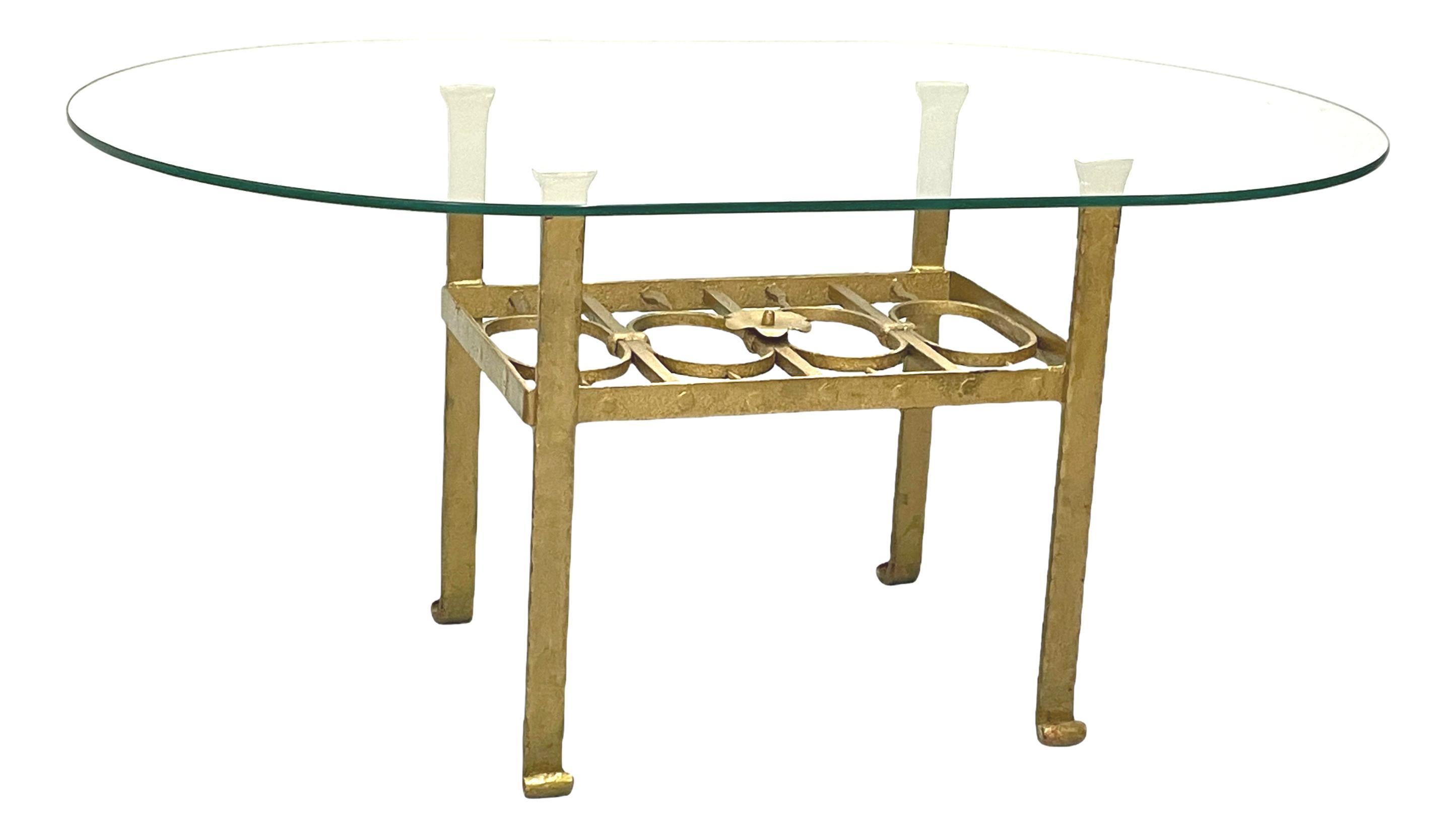 Offered is this beautiful Brutalist style gilded heavy iron coffee table with glass top. Made in Germany, circa 1960s. Glass tabletop in excellent condition. This table comes from the liquidation of the Continental Hotel in Bamberg, Germany. For