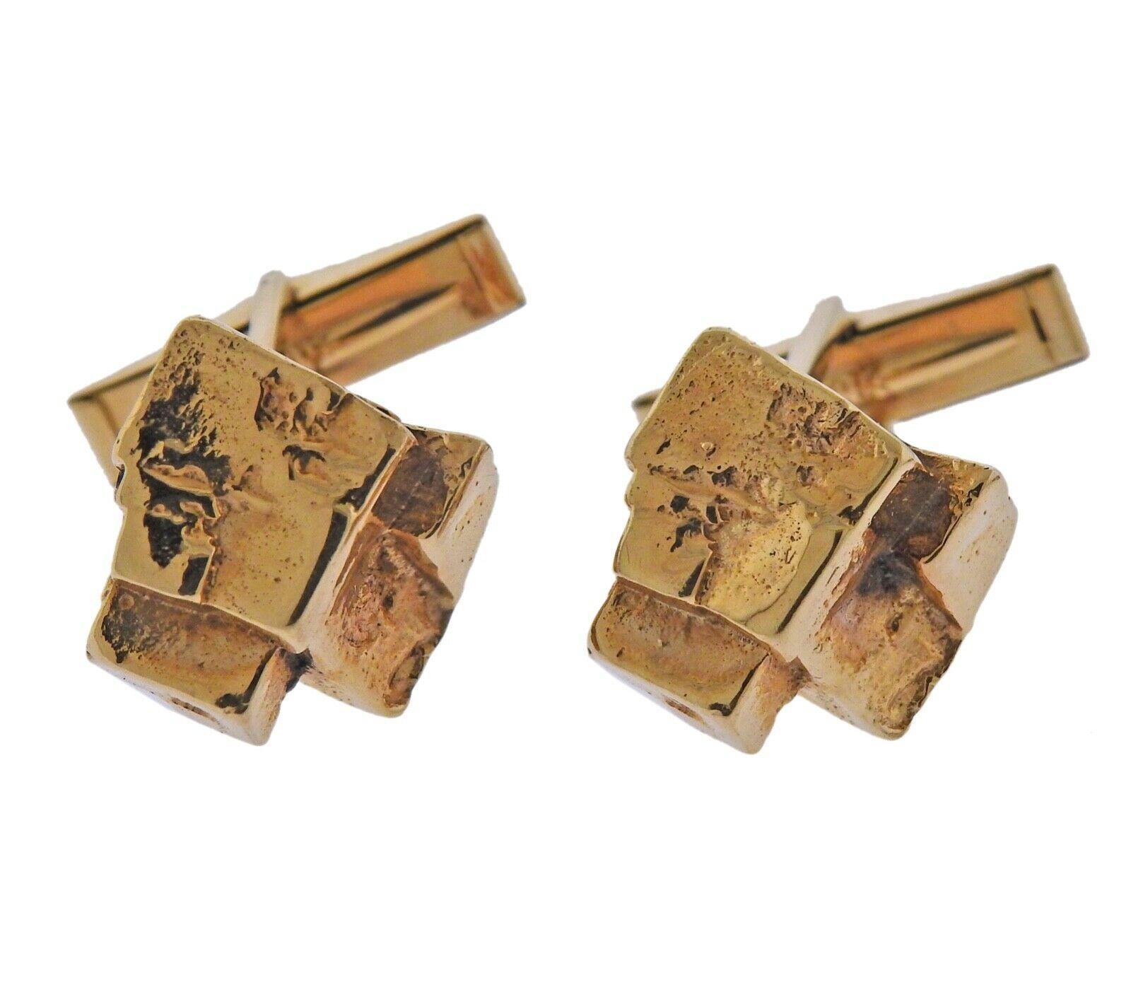 14k yellow gold nugget cufflinks stud set. Cufflinks tops measure approximately 14mm x 12mm. Studs measure 8mm x 10mm. Tested- 14k. Weight - 39.1 grams. 
