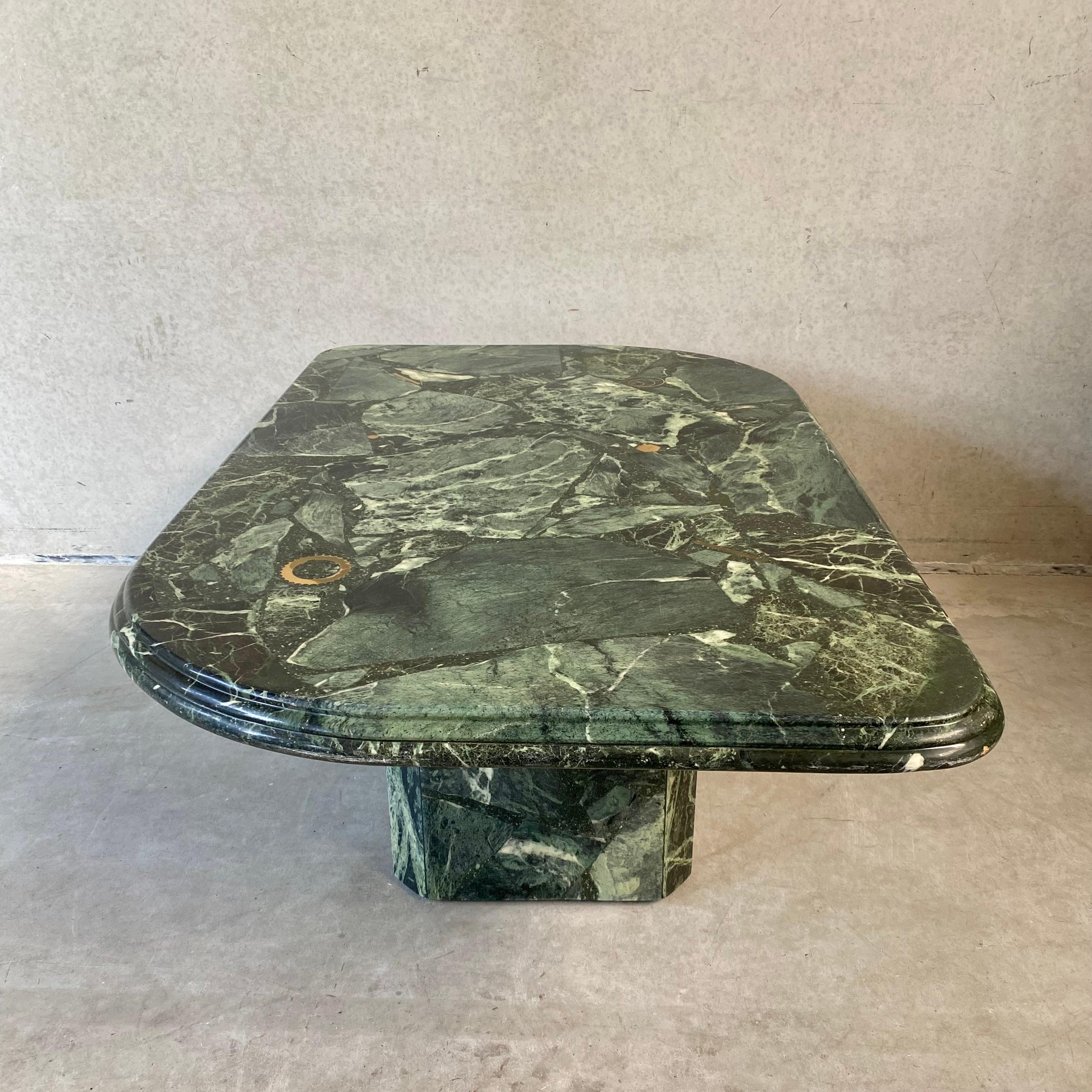 Introducing the Vintage Green Marble Brutalist Coffee Table by FEDAM

Add a touch of timeless elegance and striking design to your living space with the Vintage Green Marble Brutalist Coffee Table by FEDAM. This exquisite piece, made in 1980,