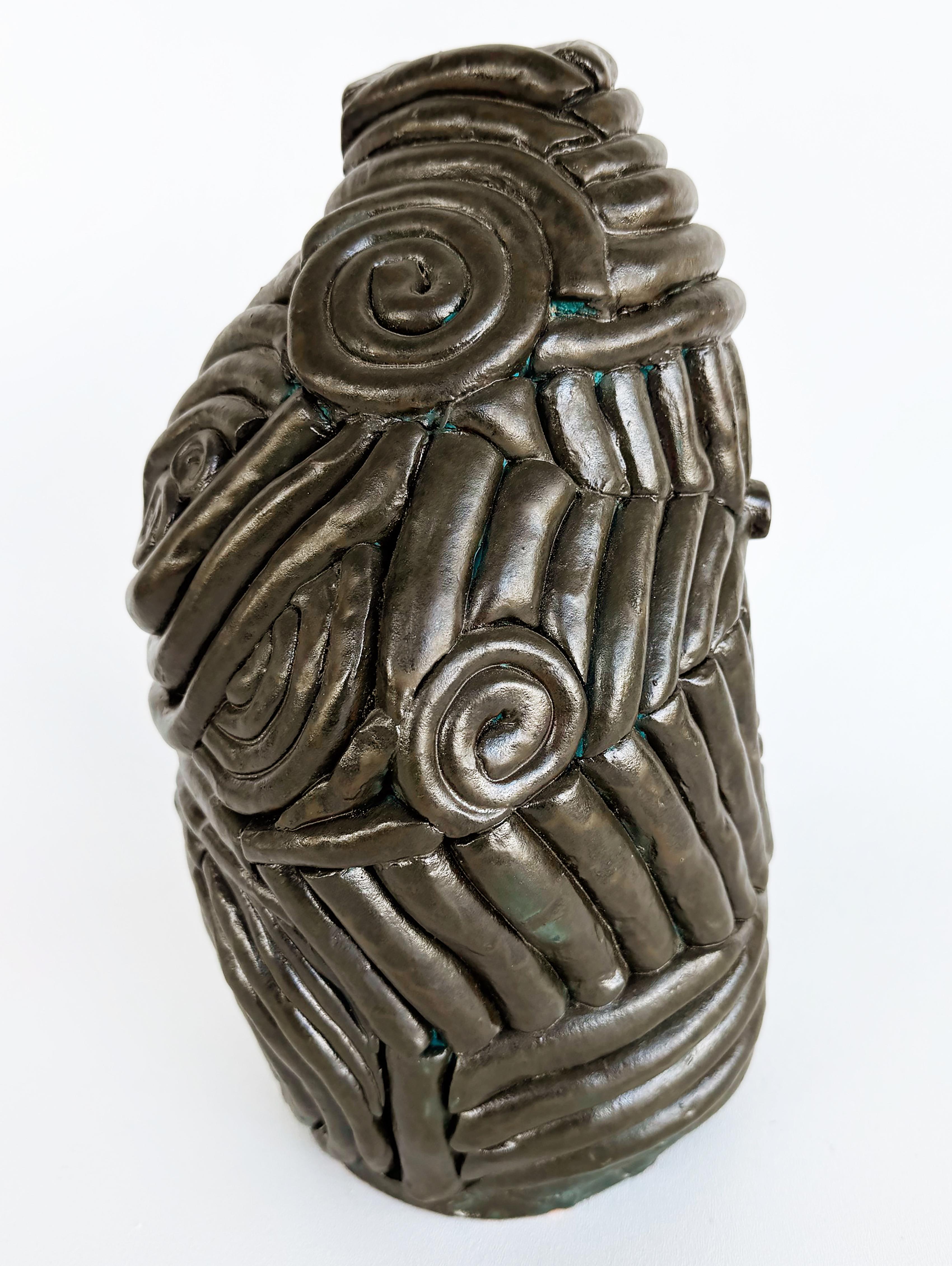Brutalist Hand-Built Glazed Coil Terracotta Studio Pottery Vase


Offered for sale is a handsome brutalist vase made of ceramic coils adhered to an underlying terracotta form. At 13” in height, its irregular form has weight and heft. The glaze is