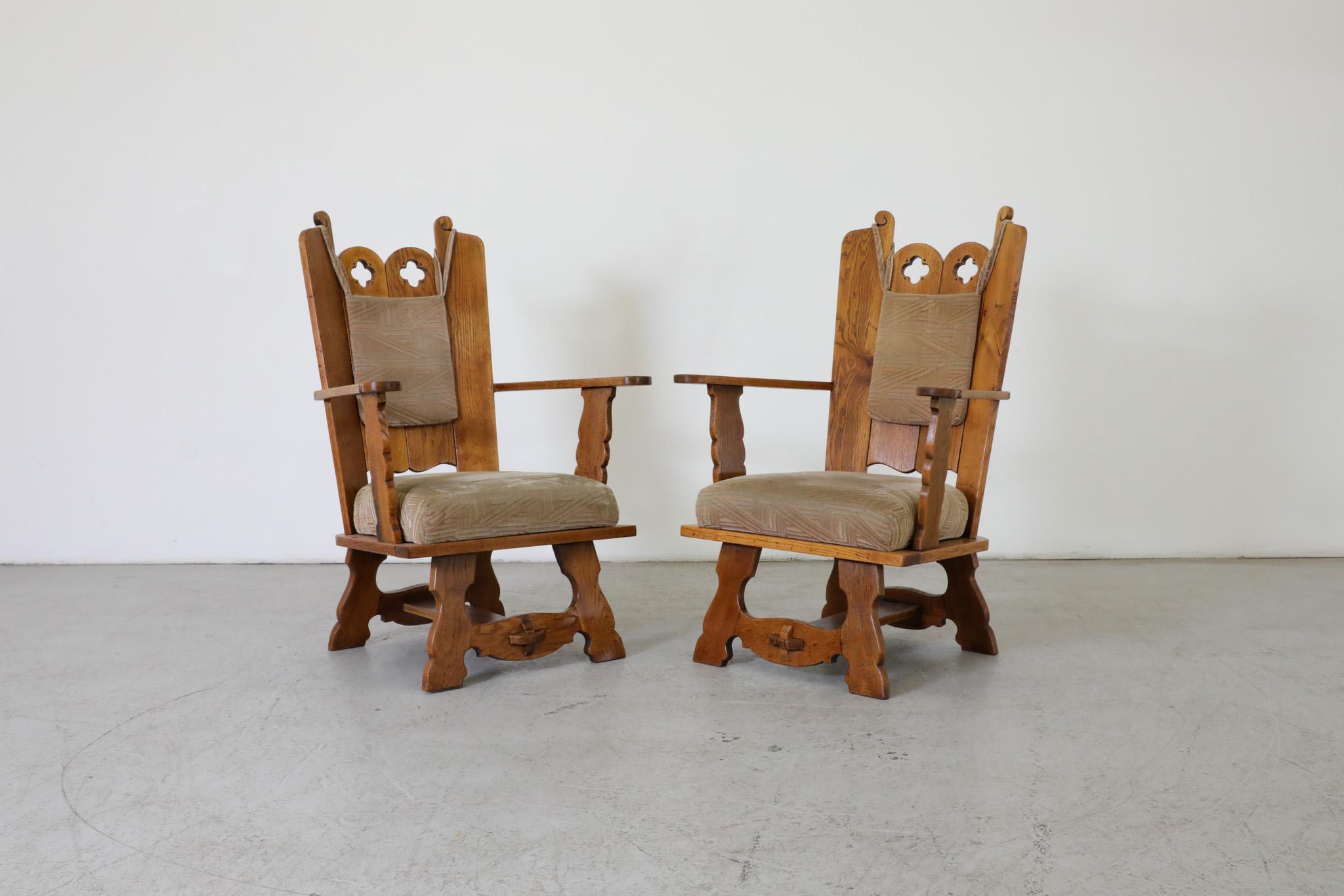 Early 20th Century Brutalist lounge chairs with solid oak frames, beautifully carved details and original fabric cushions. Elegant high back chairs all in similar original condition with varying grain patterns. Wear is consistent with their age and