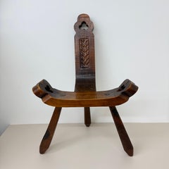 Brutalist hand carved oak Spanish tripod chair , 1970s