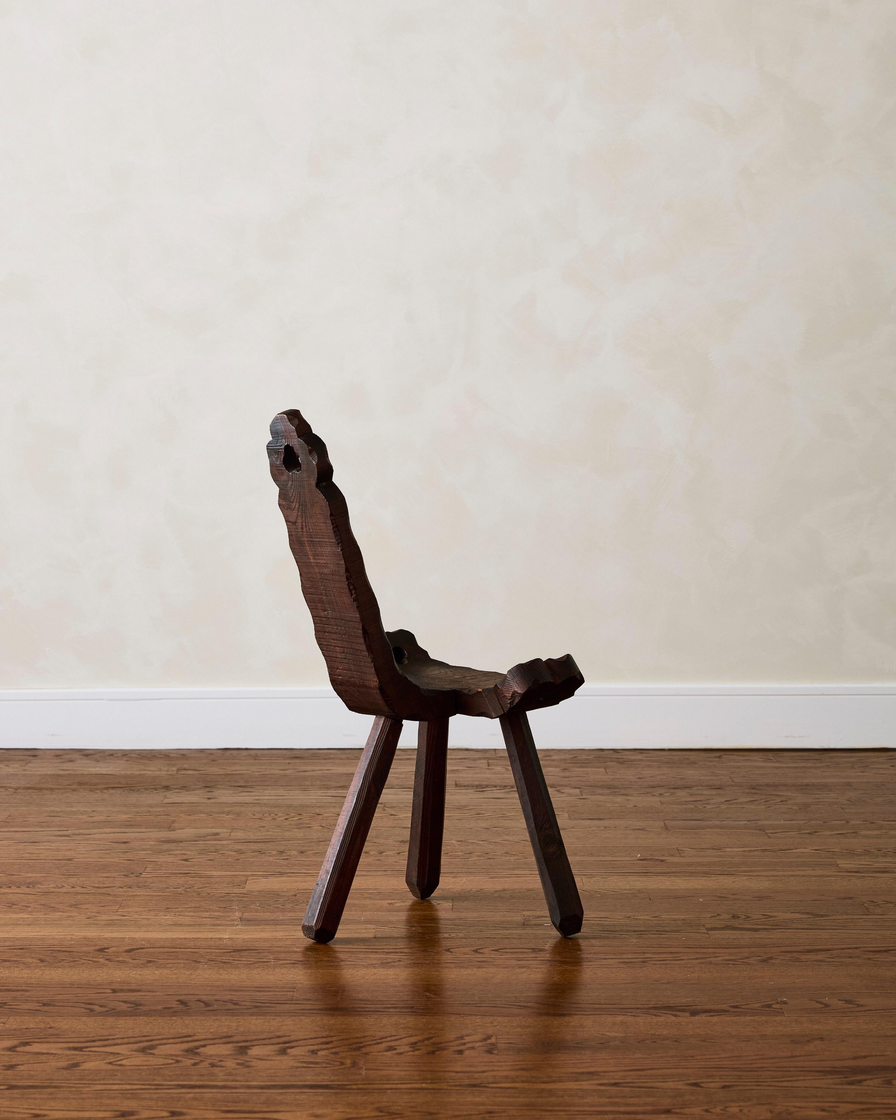 Brutalist hand-carved tripod chair, crafted in solid oak.