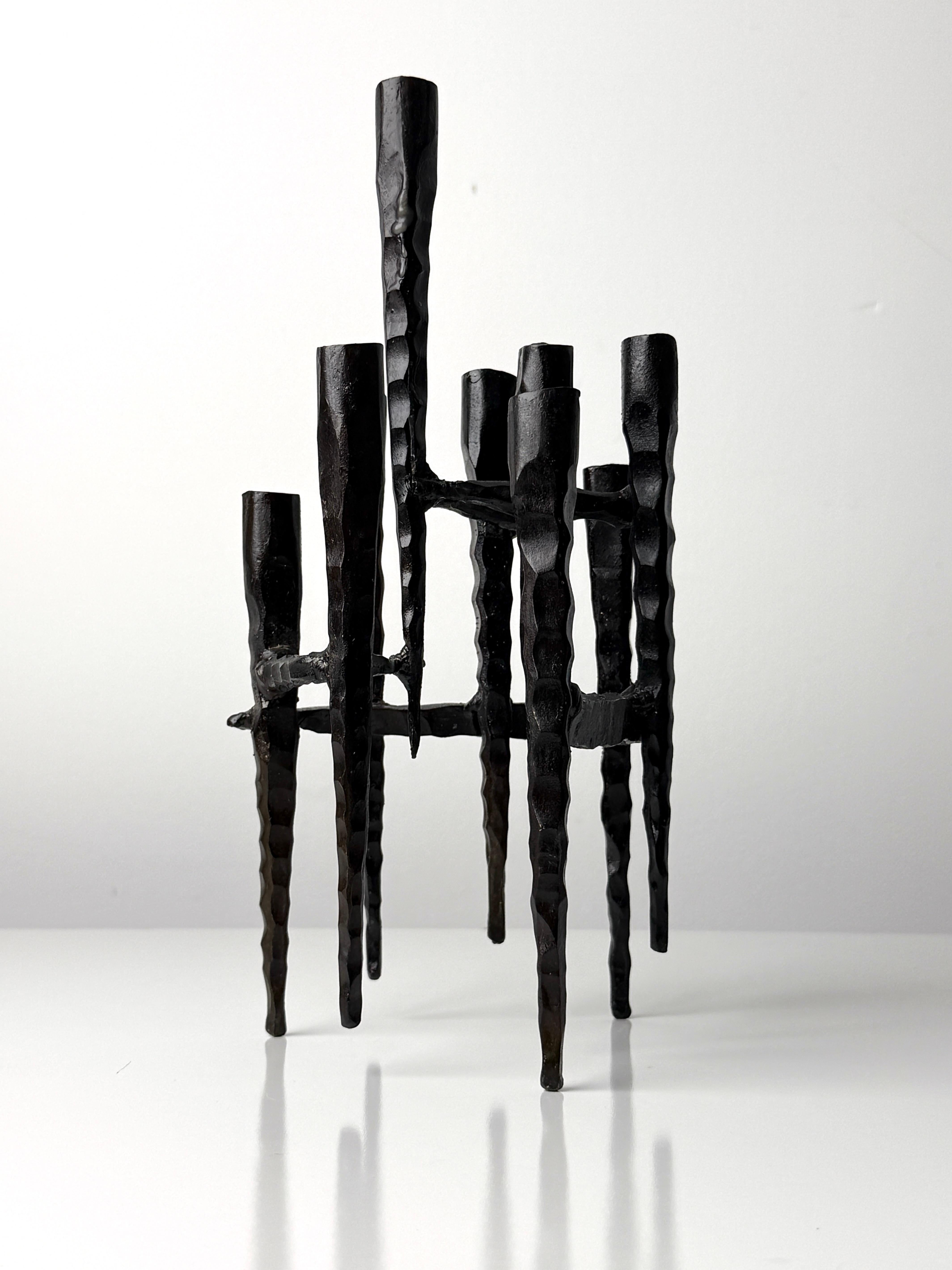 Mid Century hand forged iron sculptural Hanukkah lamp by renowned Israeli artist David Palombo (1920-1966) circa 1960

A sculptural menorah of conjoined holders in a stalactite like design 
Executed in Palombo's signature brutalist style 

12 inch