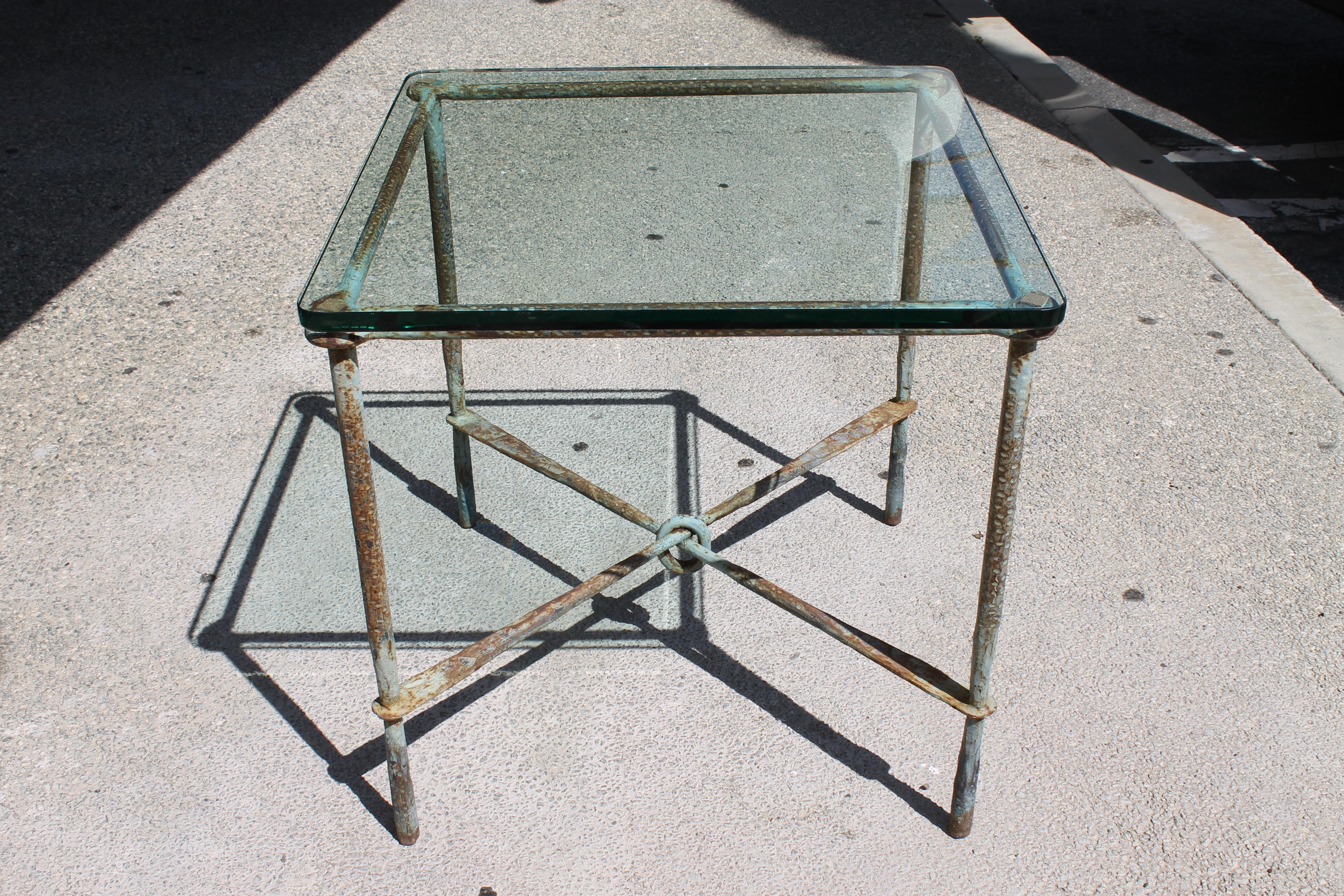 Hand hammered steel side table with original patina. We purchased a 3/4