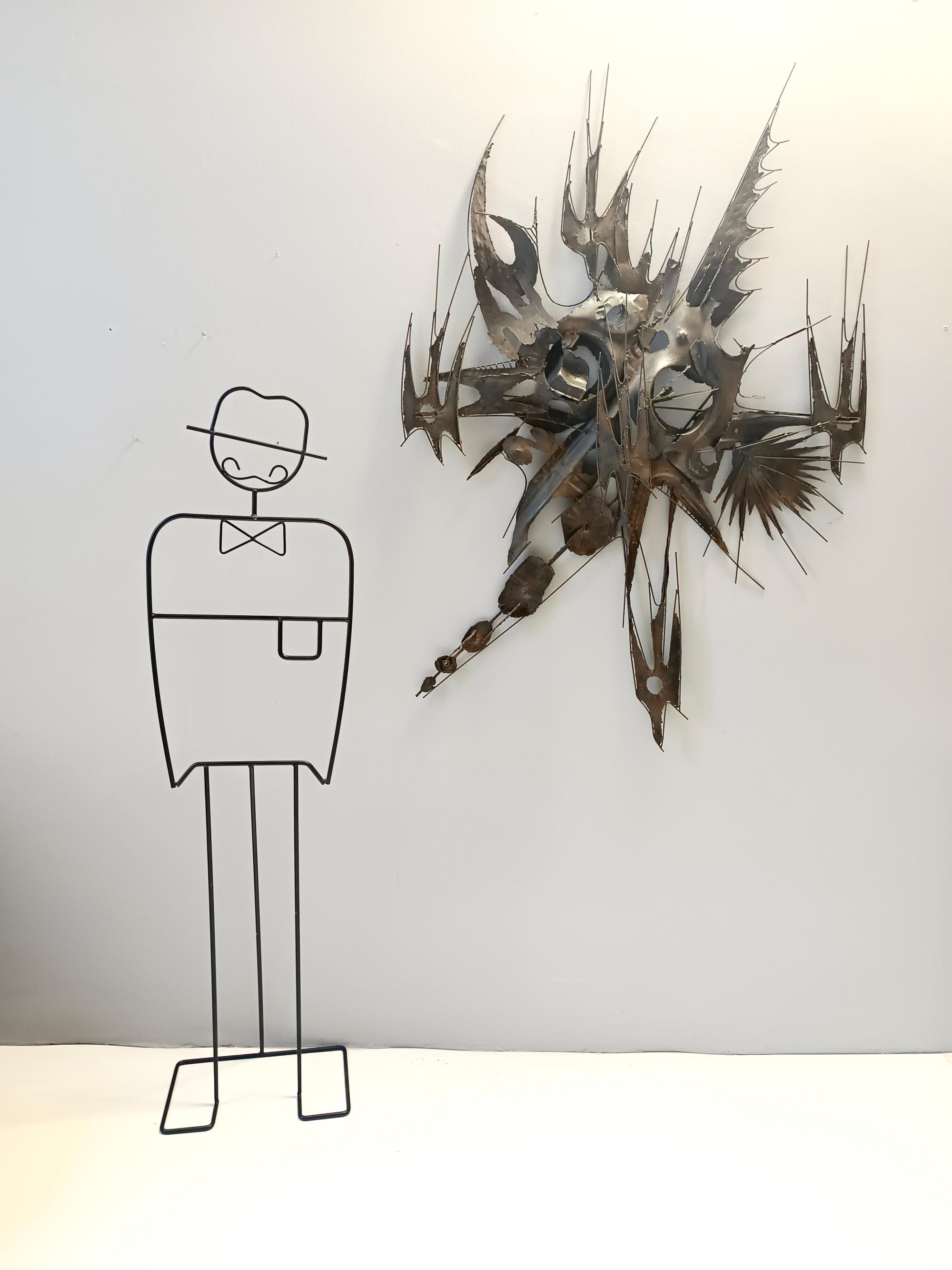 Made in Italy, 1970s. 
It is made in iron entirely worked by hand. 
This sculptural panel of great scenographic impact unfortunately it is not signed but it is certainly by M. Di Giovanni as they are found on internet of the same series.
It is in