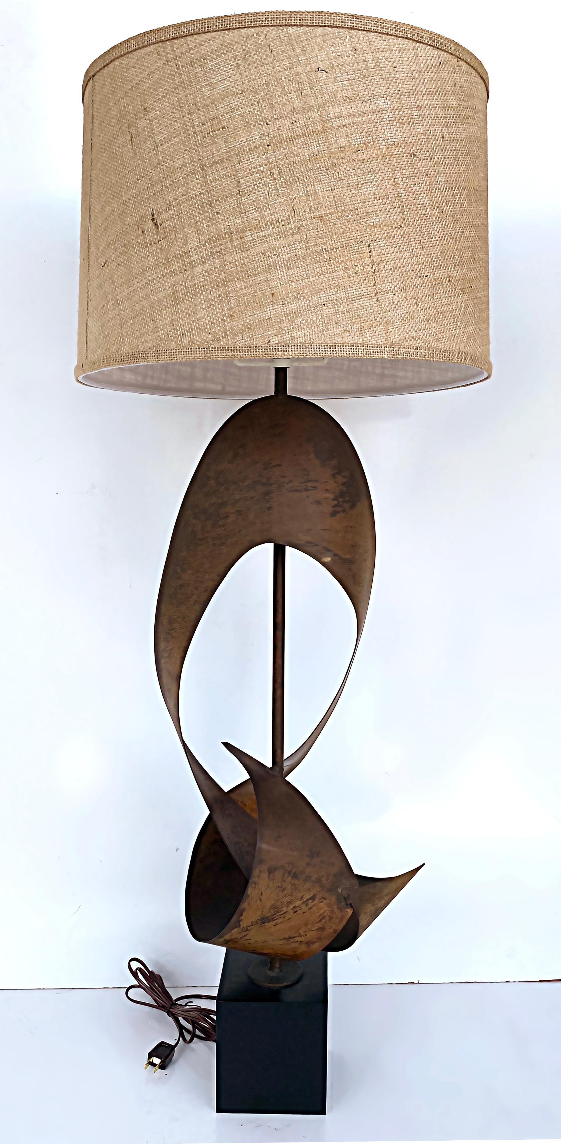 Brutalist Harry Balmer Harold Weiss Laurel Ribbon Table Lamps with New Shades

Offered for sale is a pair of 1970s monumental Brutalist Laurel table lamps by Harry Balmer and Harold Weiss. The lamps have a patinated ribbon form metal sculptural