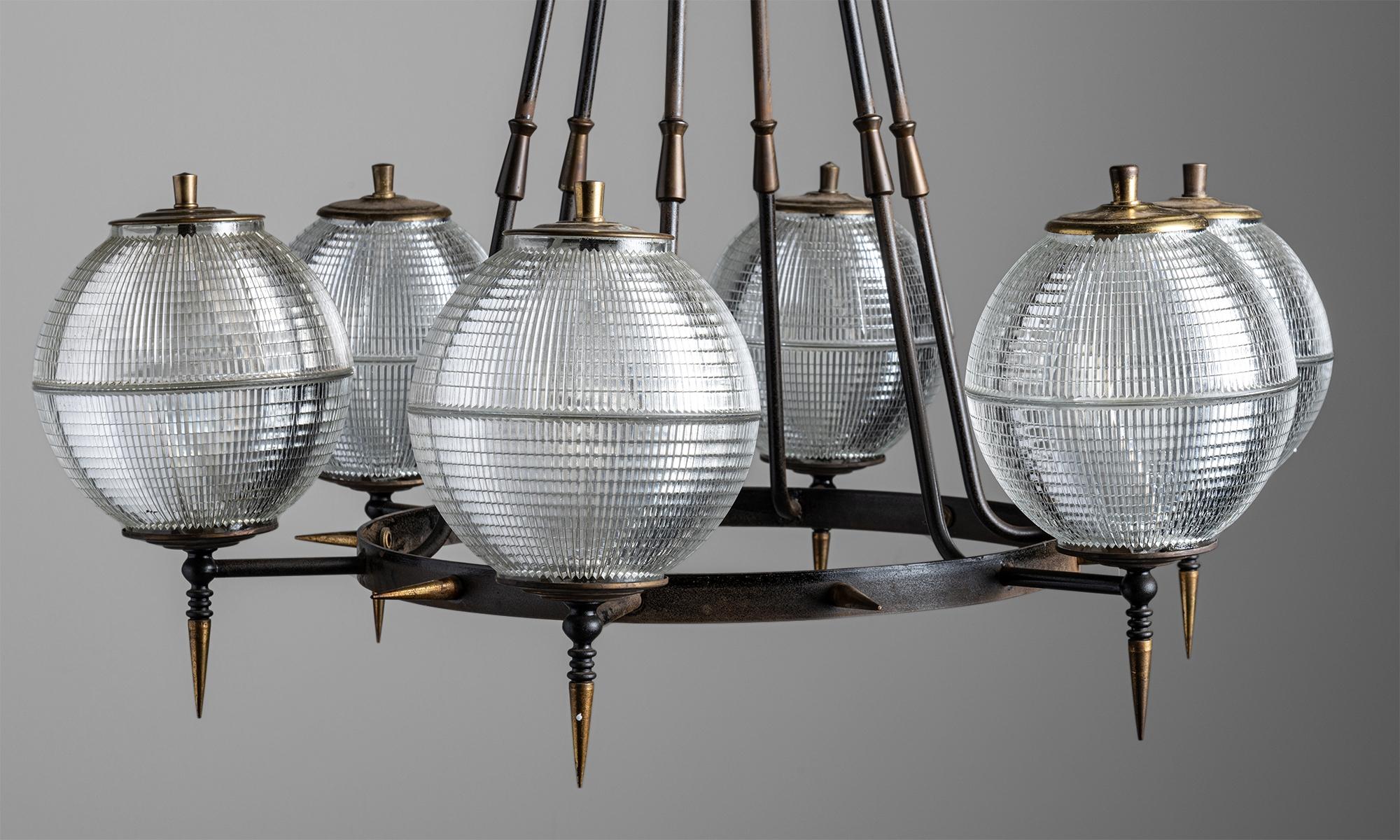 Brutalist Holophane chandelier,
Germany, circa 1960
Black metal with brass details and six holophane globes.
Measures: 29.5” diameter x 23.25” height.