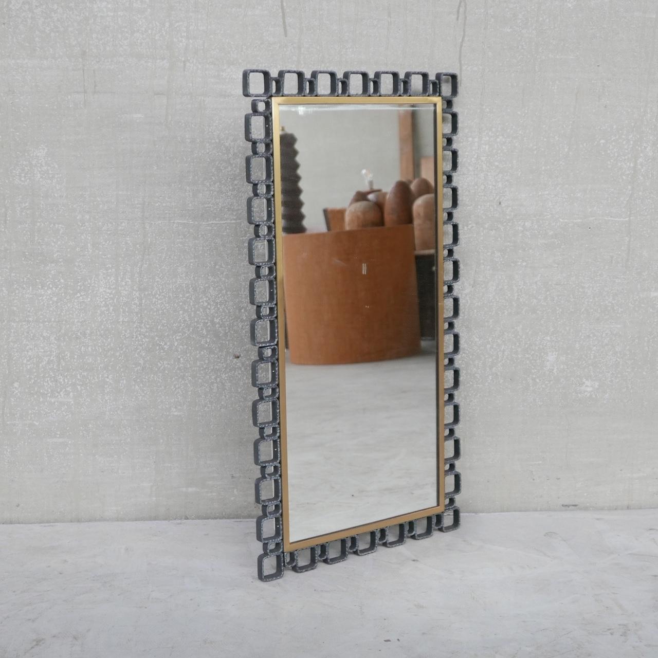 A stylish iron brutalist mirror. 

Belgium, c1970s. 

Iron cubist surround with a brass insert. 

The mirror has the option to be back lit with lighting infrastructure hidden at the back. 

Good condition. 

Location: Belgium Gallery.