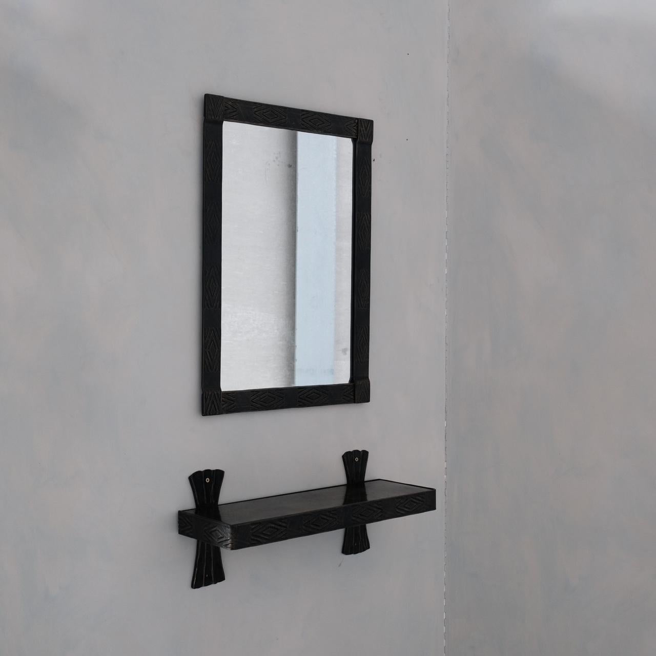 A good brutalist style mirror, with unusual wall shelf. 

Belgium, c1970s. 

The iron mirror is well formed and decorative and is the piece to have,

The shelf perhaps wants ignoring but could be a useful pairing, the shelf tray is a thin metal