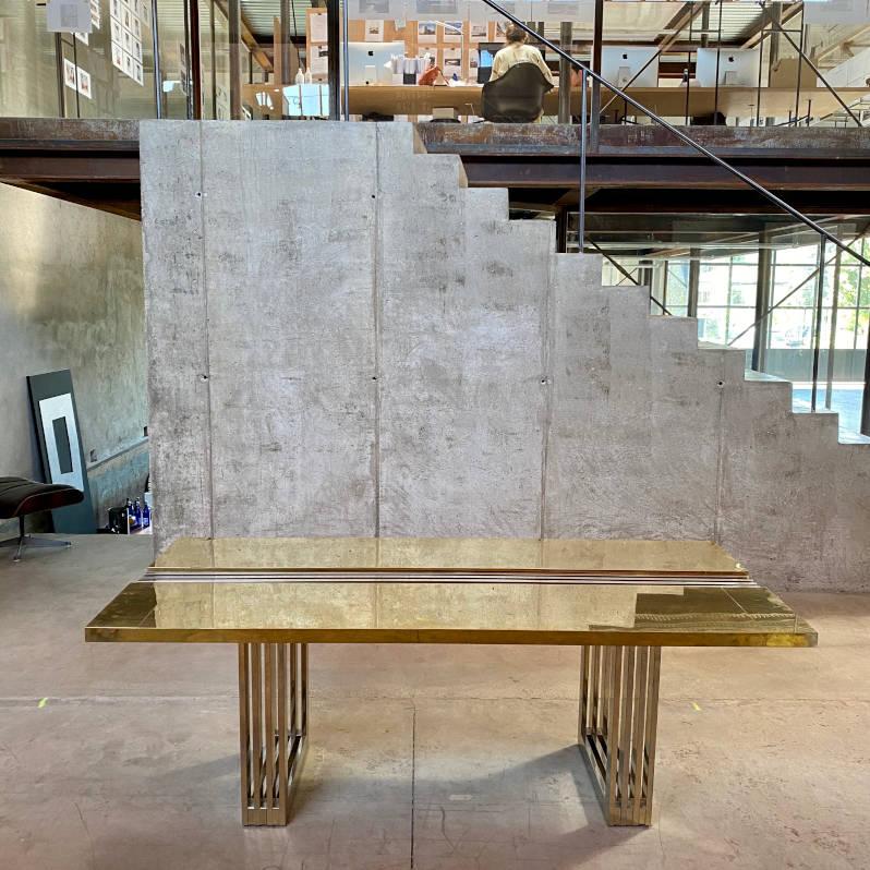 Brutalist Italian brass dining table, 1975

Unique Italian dining table, also suitable as working desk, composed of an interesting brutalist structure. Two metallic pierced squared legs holds the brass table top, cut in the middle with a metallic