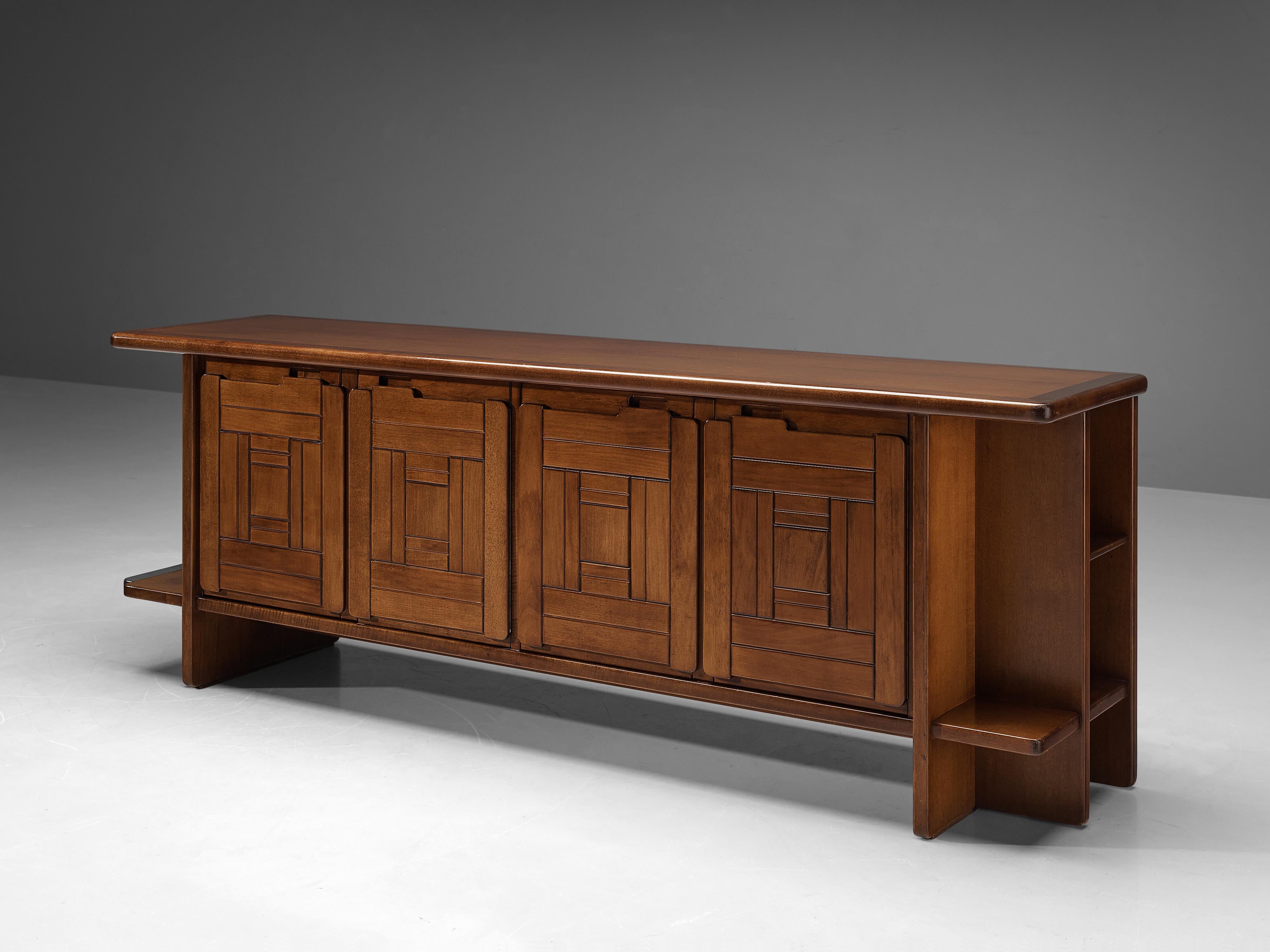 Sideboard, walnut, Italy, 1970s

This sideboard is a good example of excellent woodworking by virtue of the graphical designed doors adding a wonderful rhythmic and haptic surface to the front. The design of the frame which is executed in
