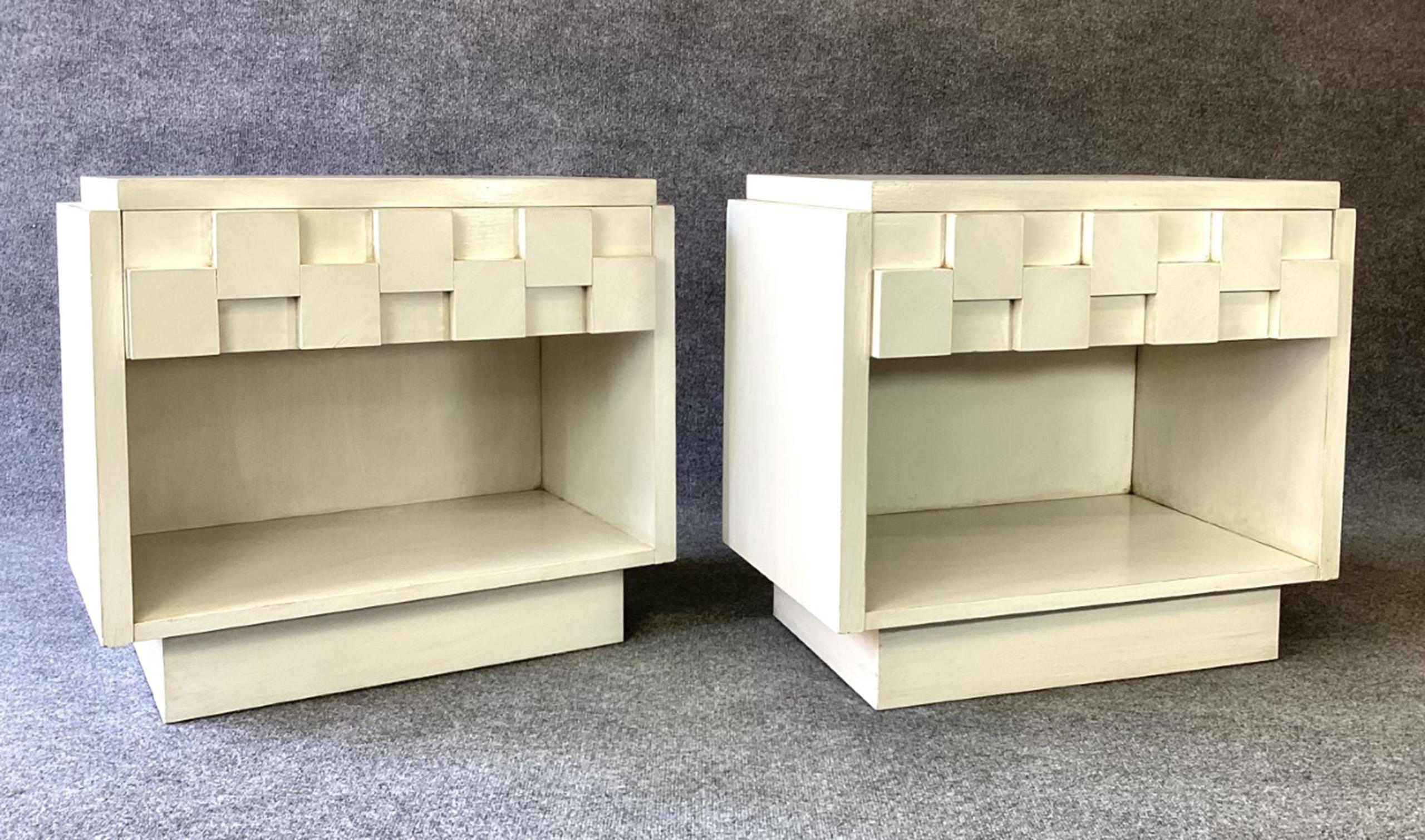 For your consideration, an incredible Brutalist or Staccato Collection pair of nightstands or end tables, produced by The Lane Furniture Company in the 1960s. In a fabulous custom antiqued and burnished white enamel finish, using a custom technique