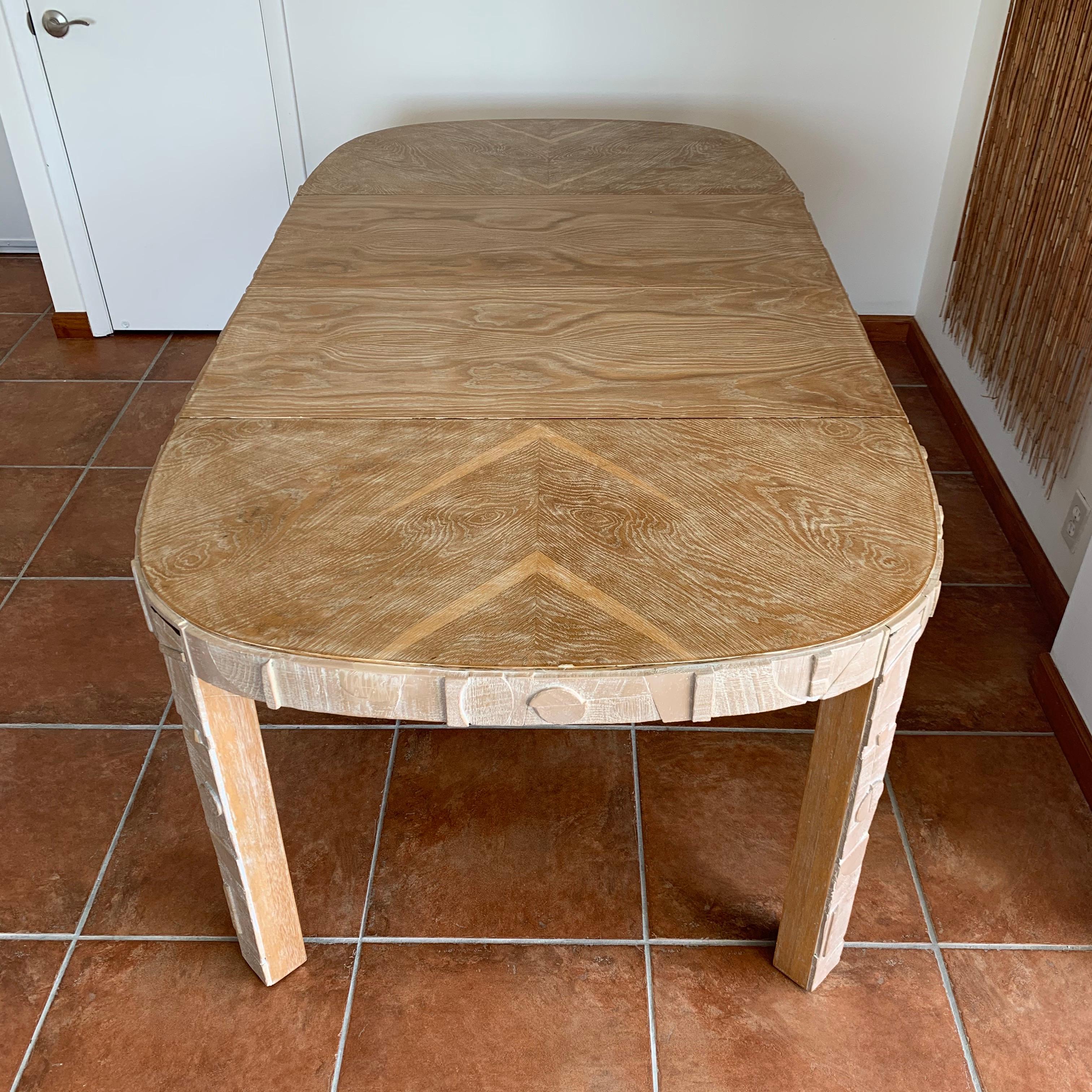 Dining table, with geometric curved Brutalist motif, expandable with two 18