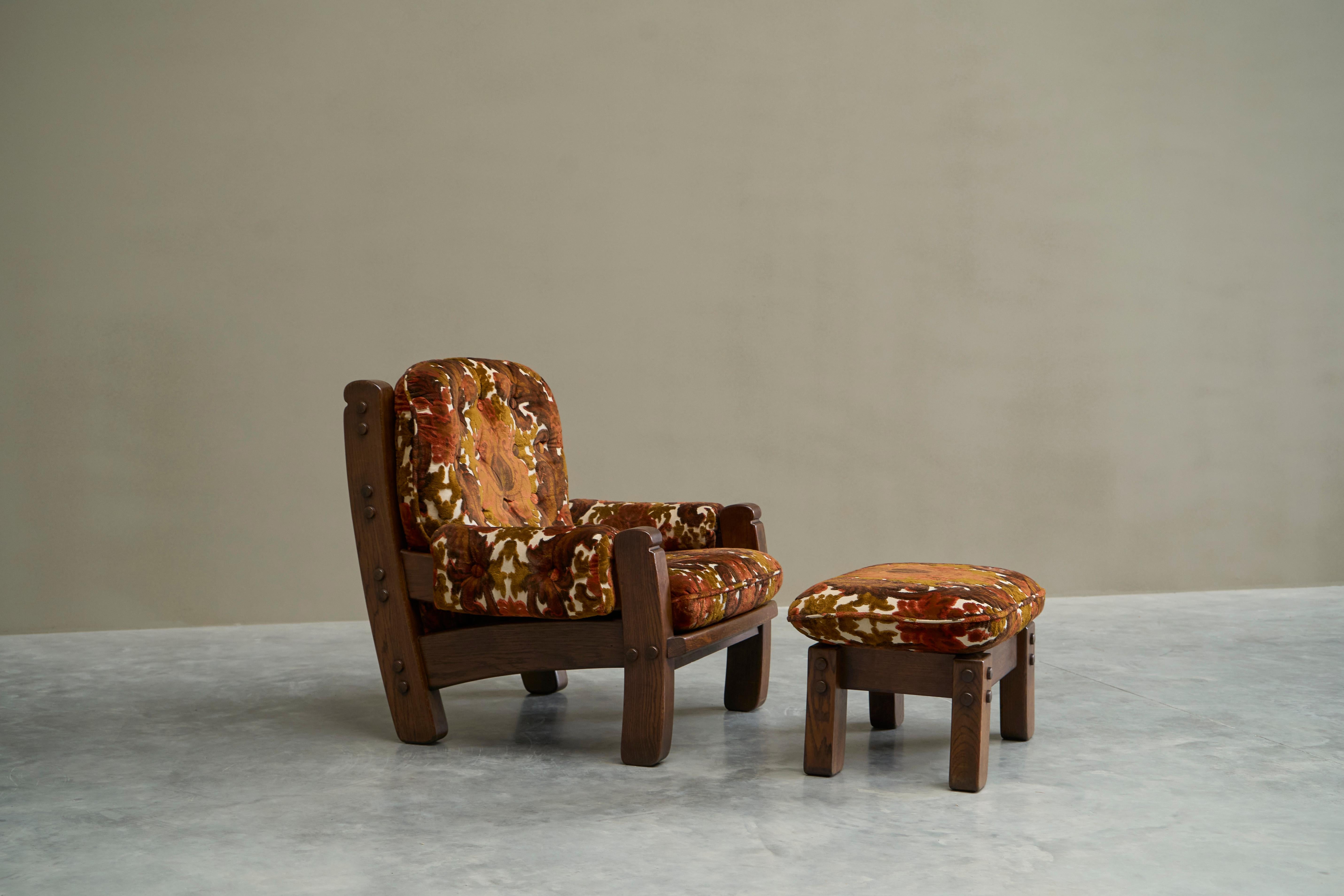 Brutalist Lounge Chair and Ottoman in Solid Oak and Velvet 1960s

An astonishing lounge chair from the late 1960s in solid oak with magnificent floral velvet upholstery. Please note: we do have 5 of these in stock (only one ottoman! 

Heavy and bold