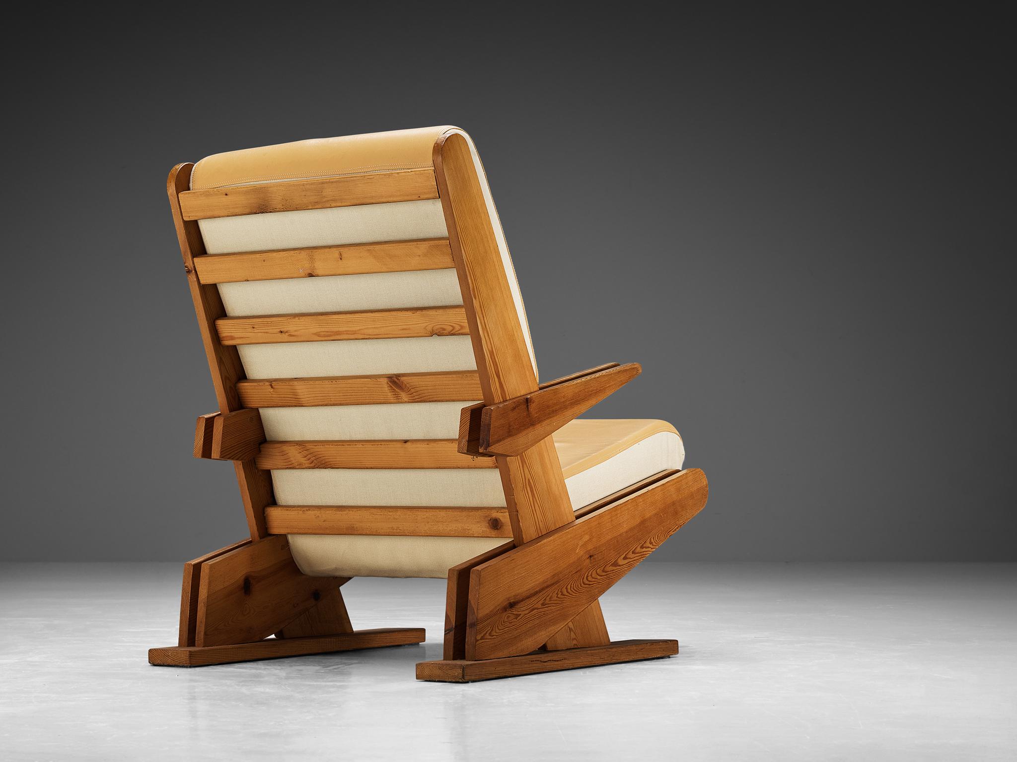 Lounge chair, pine, faux leather, fabric, Europe, 1970s

This distinctive chair reflects the stylistic traits of Brutalism. The wooden framework in pine is pure and clear in its execution with sharp, angular lines forming its design. The angular