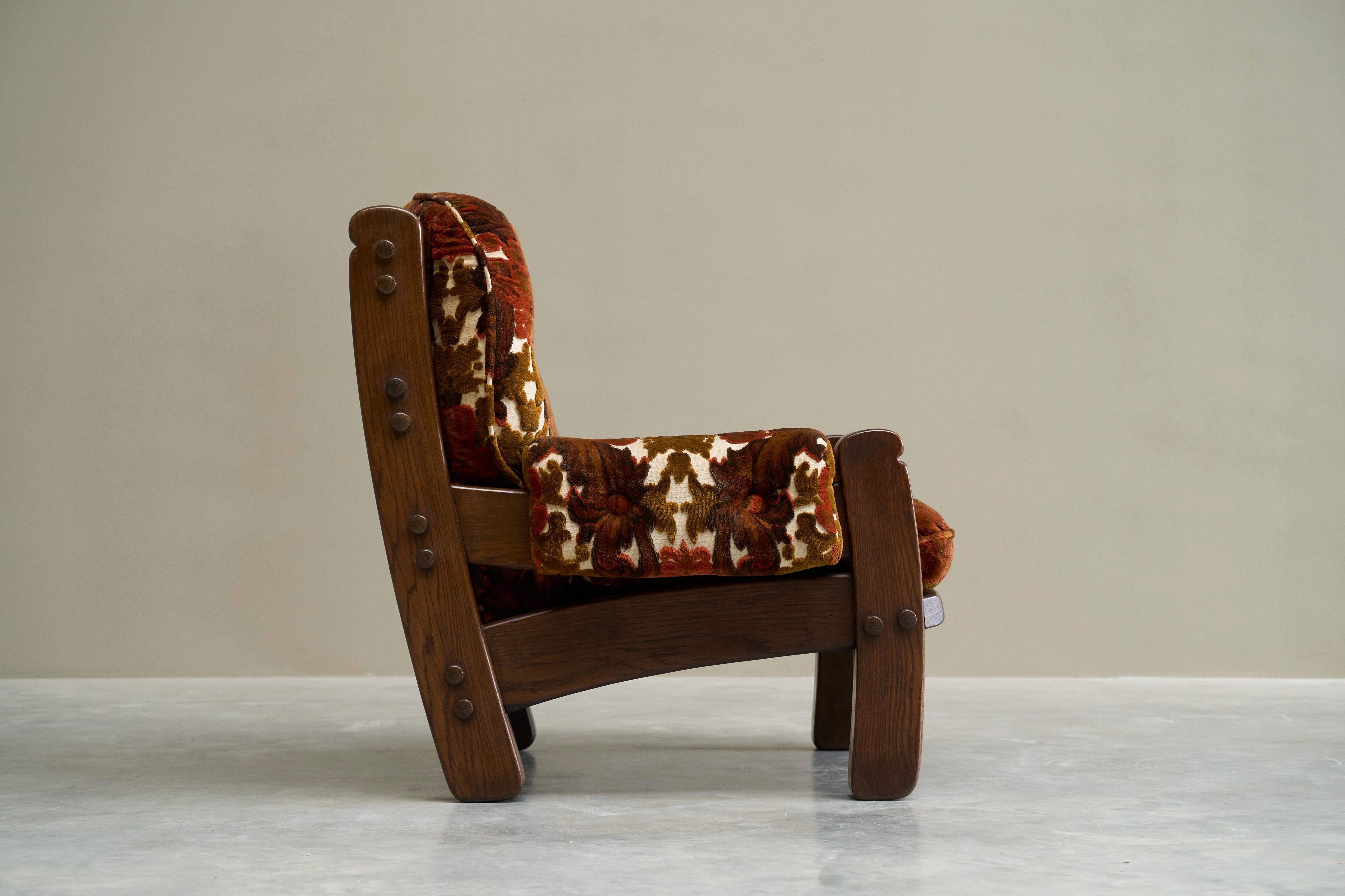Brutalist Lounge Chair in Solid Oak and Velvet 1960s

An astonishing lounge chair from the late 1960s in solid oak with magnificent floral velvet upholstery. Please note: we do have 5 of these in stock (only one ottoman)! 

Heavy and bold - both in