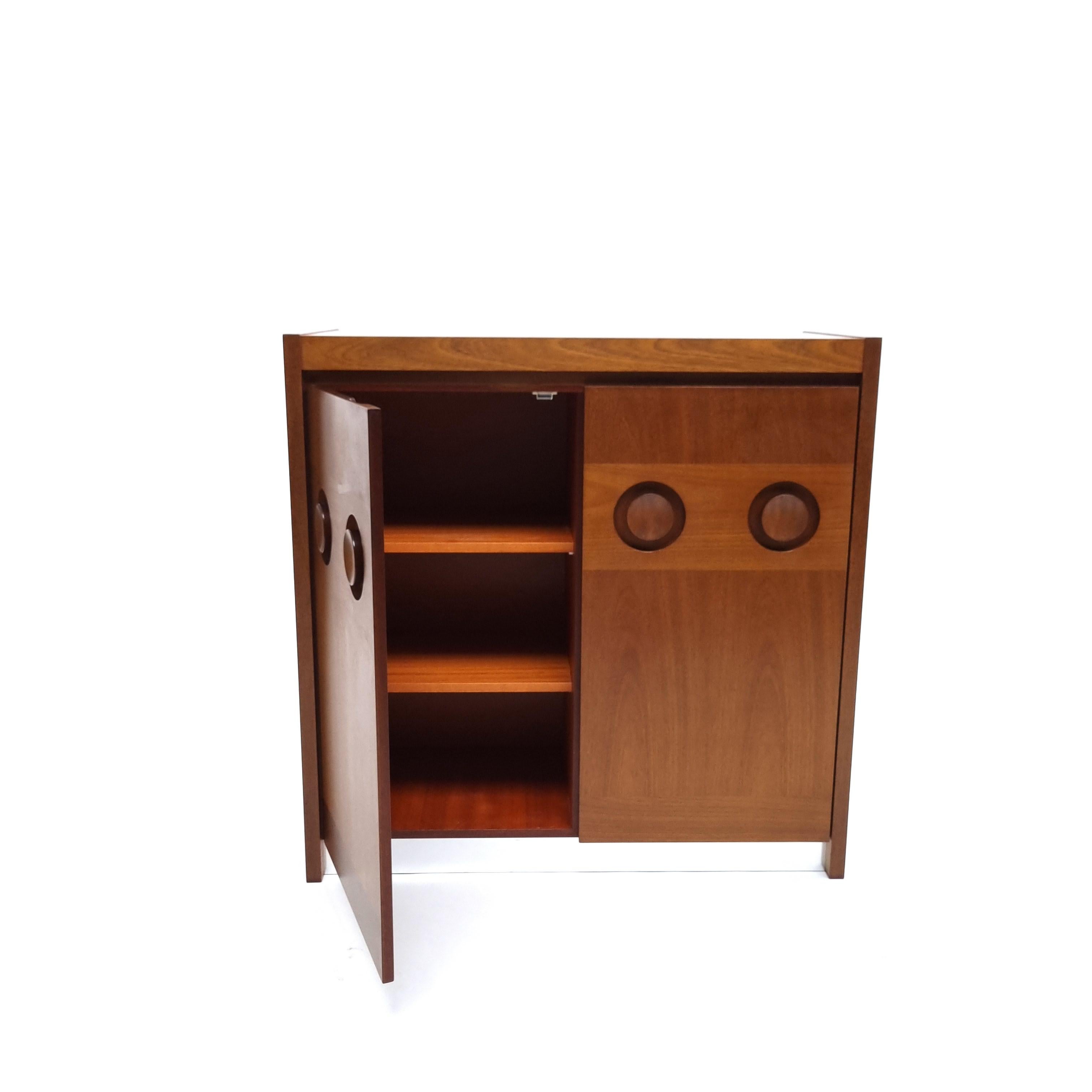 Brutalist mahogany sideboard or credenza by De Coene Frères. Two doors fastened by magnets open to reveal three storage cubicles.