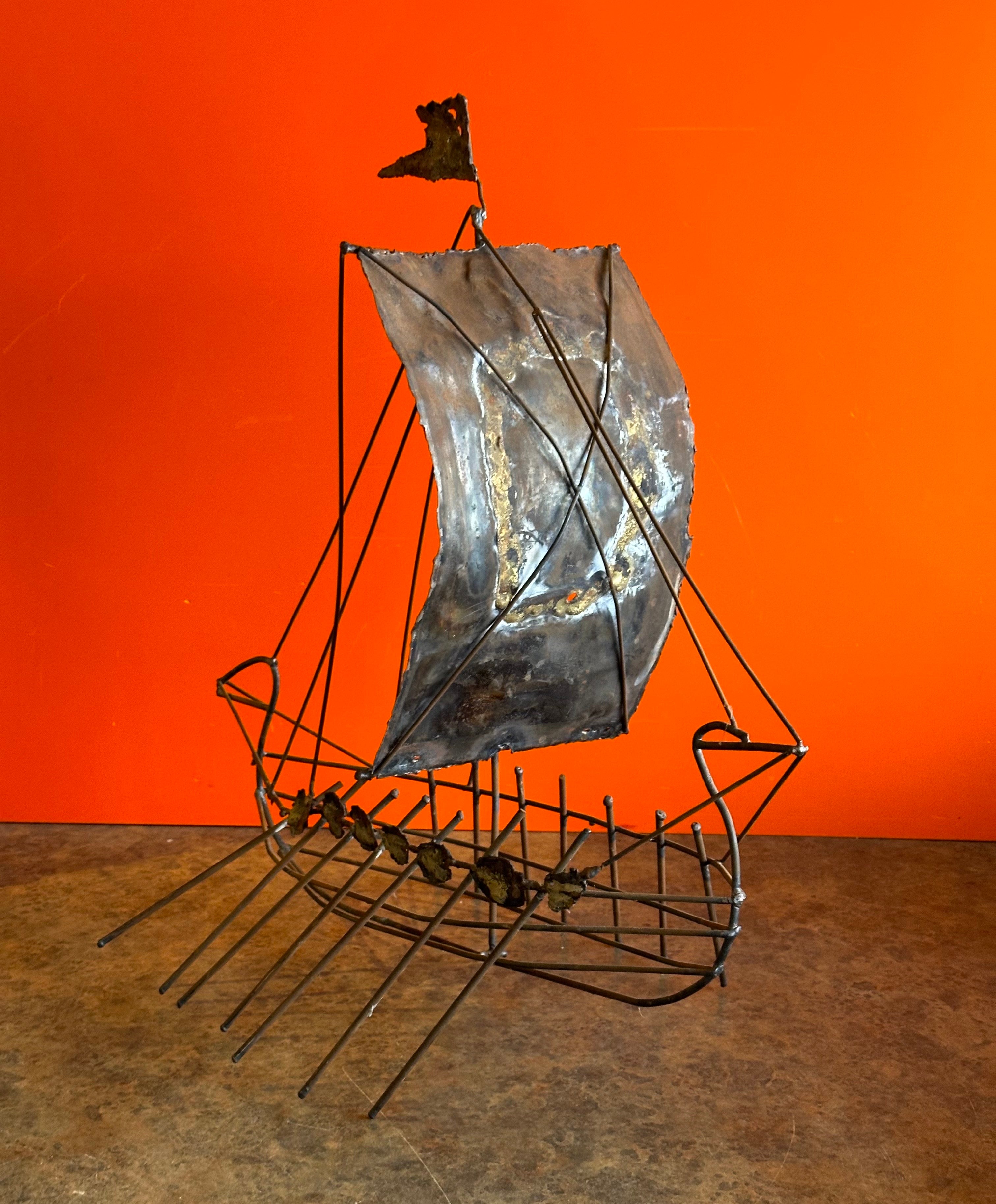 A very cool brutalist MCM viking ship sculpture, circa 1970's.  The piece is hand welded and has a great look and patina; it measures 20